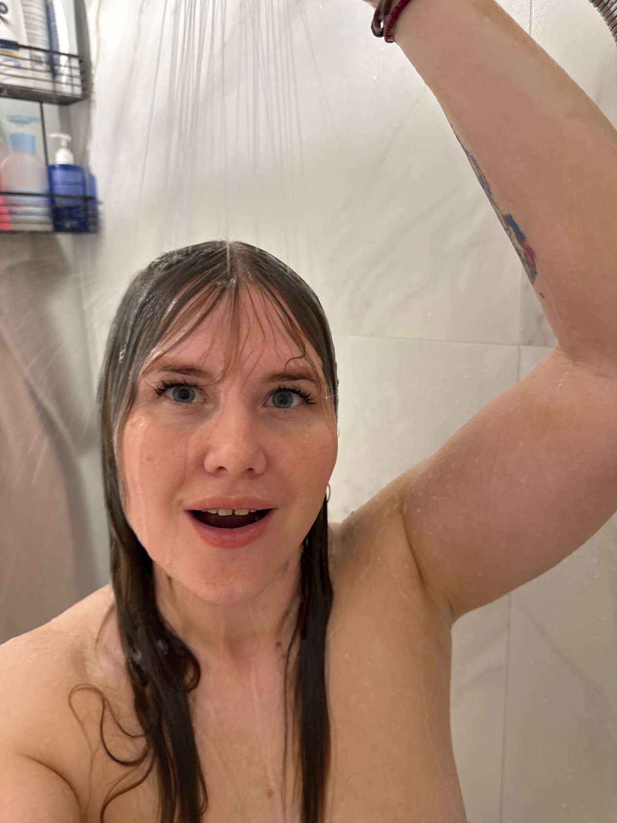 Woman photographed in bathroom during evening hours in Russia