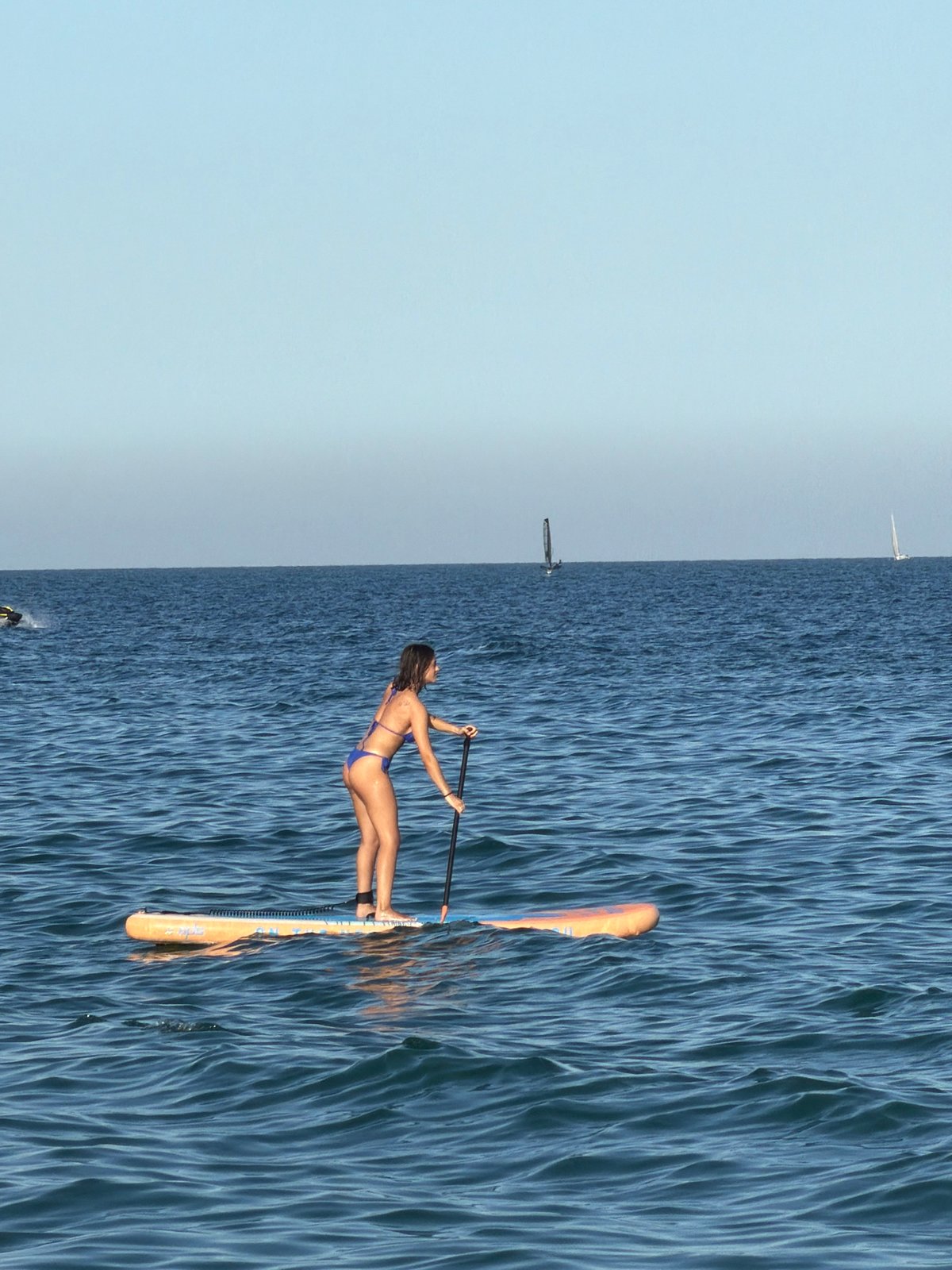 Summer day unfolds at Barcelona's Barceloneta Beach with Elvis performer