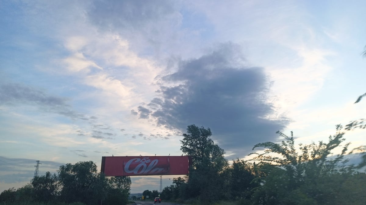 Highway journey documented near Aytos, Bulgaria with billboards, power lines