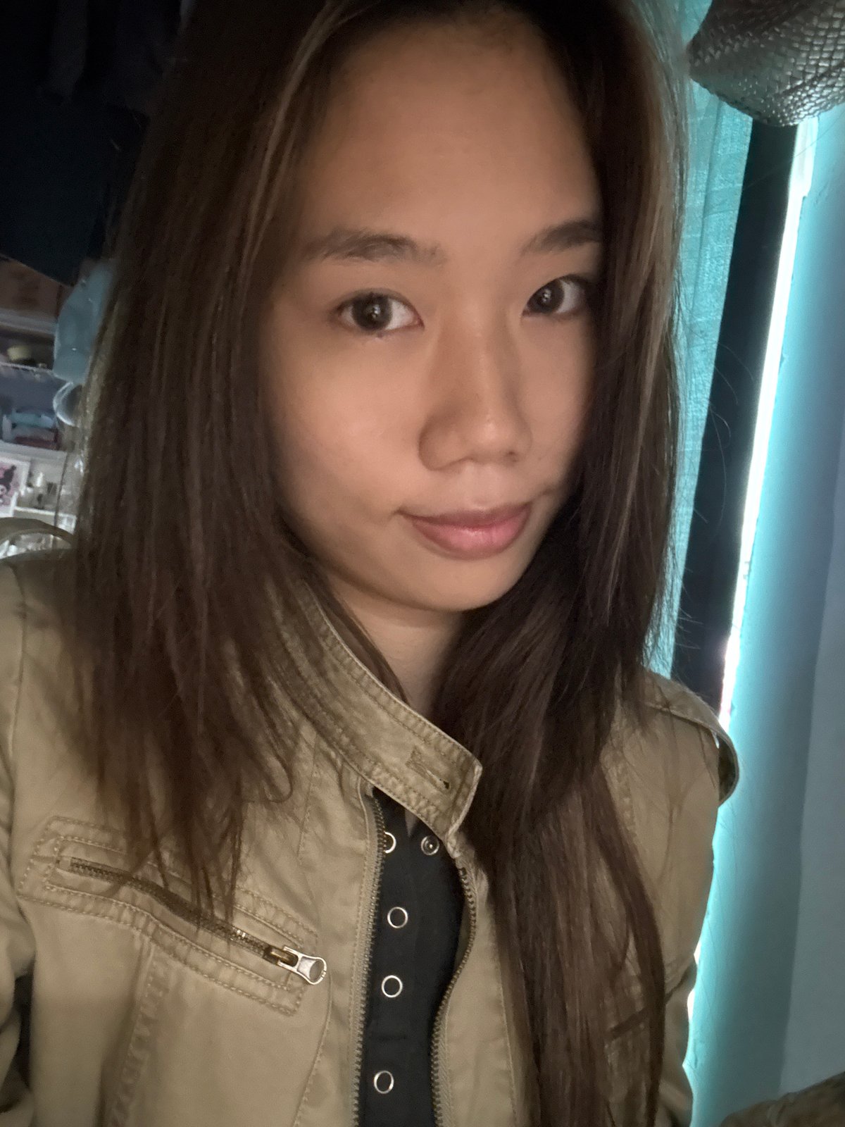 Woman poses for indoor photo in Nan'an District