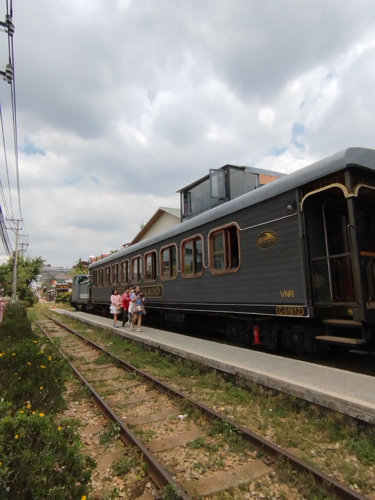 Vintage tourist train observed at dawn in Lộc Quý, Vietnam