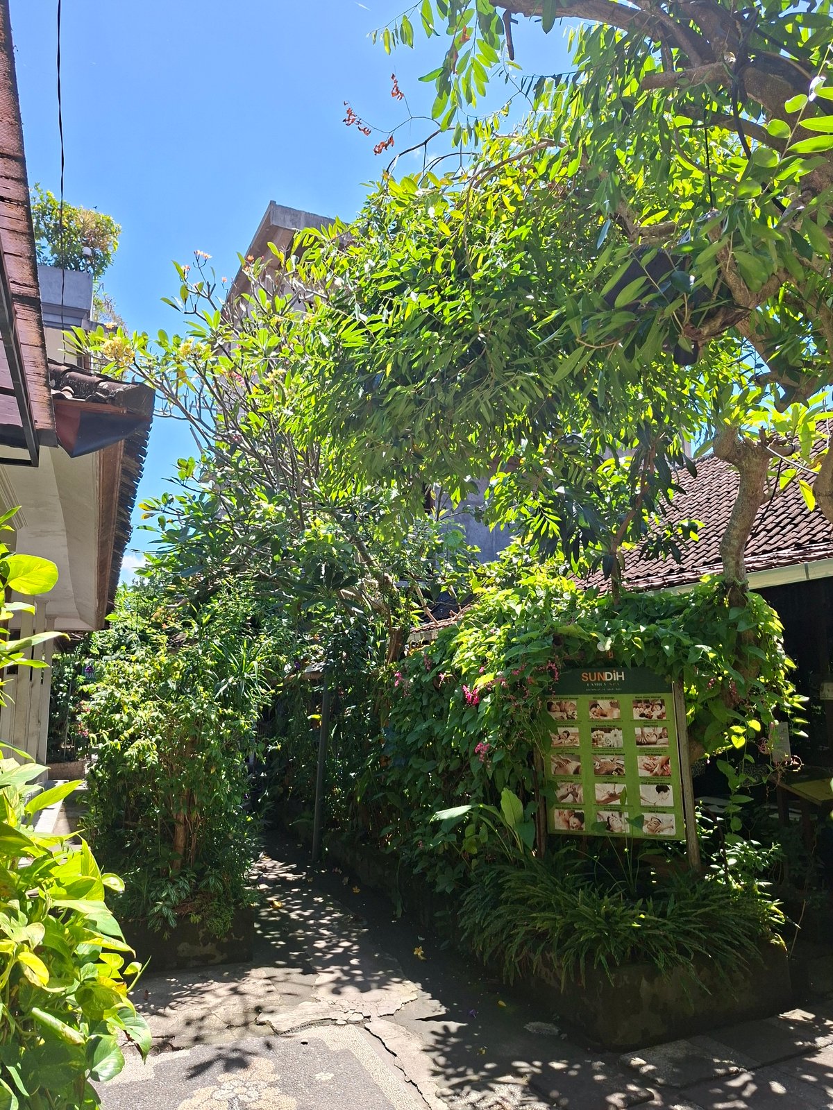 Tourist captures traditional Balinese temple complex scenes in Ubud
