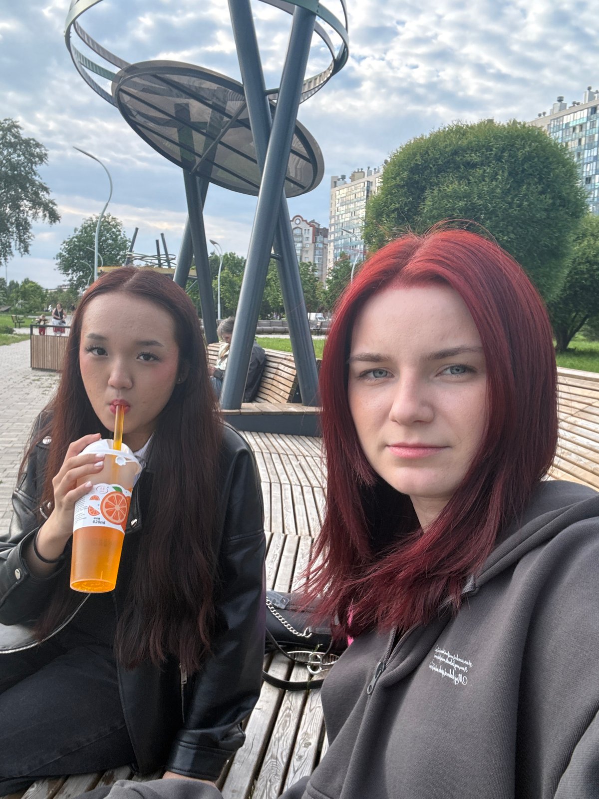 Young women gather for drinks and photos in Russian park