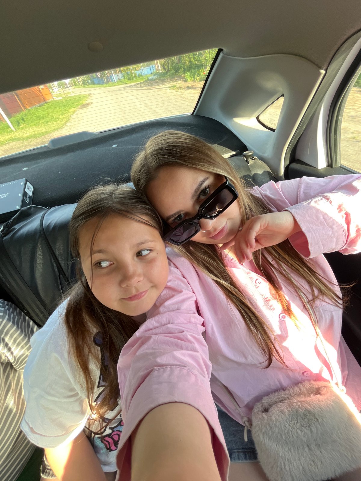 Two females photographed lying in car trunk in Russia