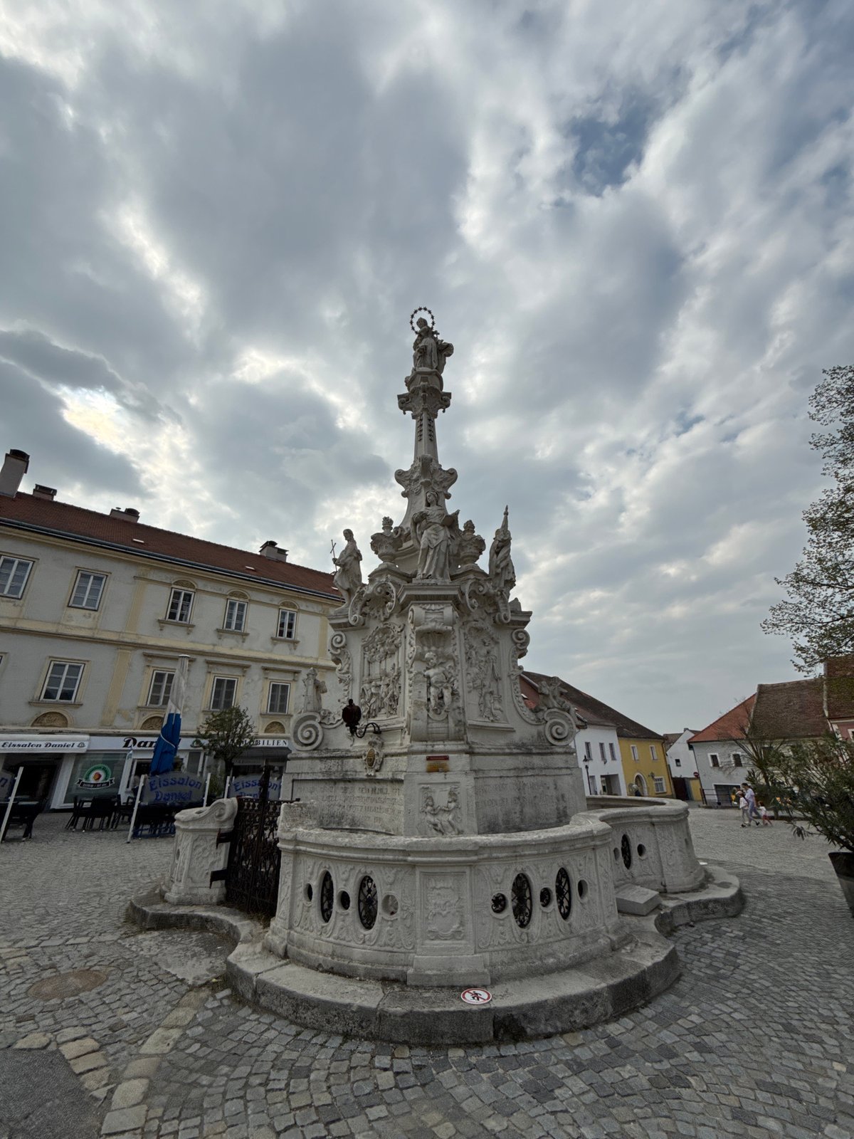 Tourist documents historic Austrian town's architecture and streets