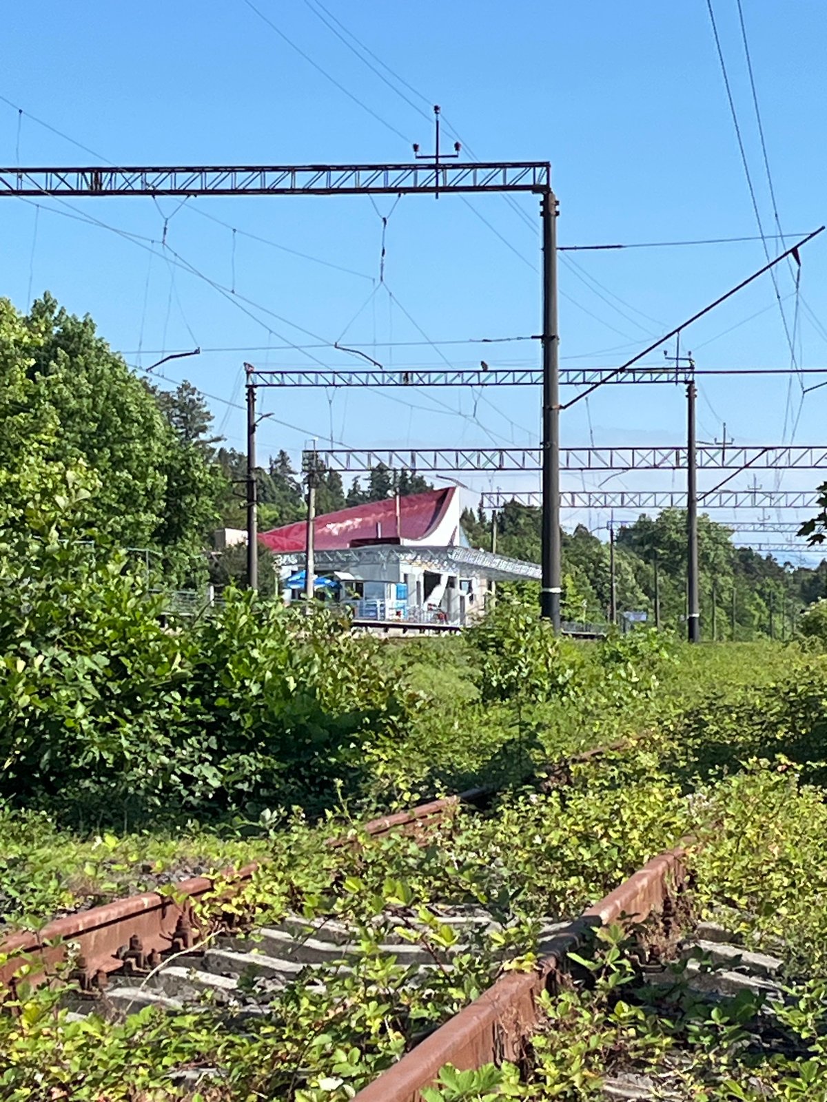 Ureki street life: railway tracks, trucks, and roadside scenes