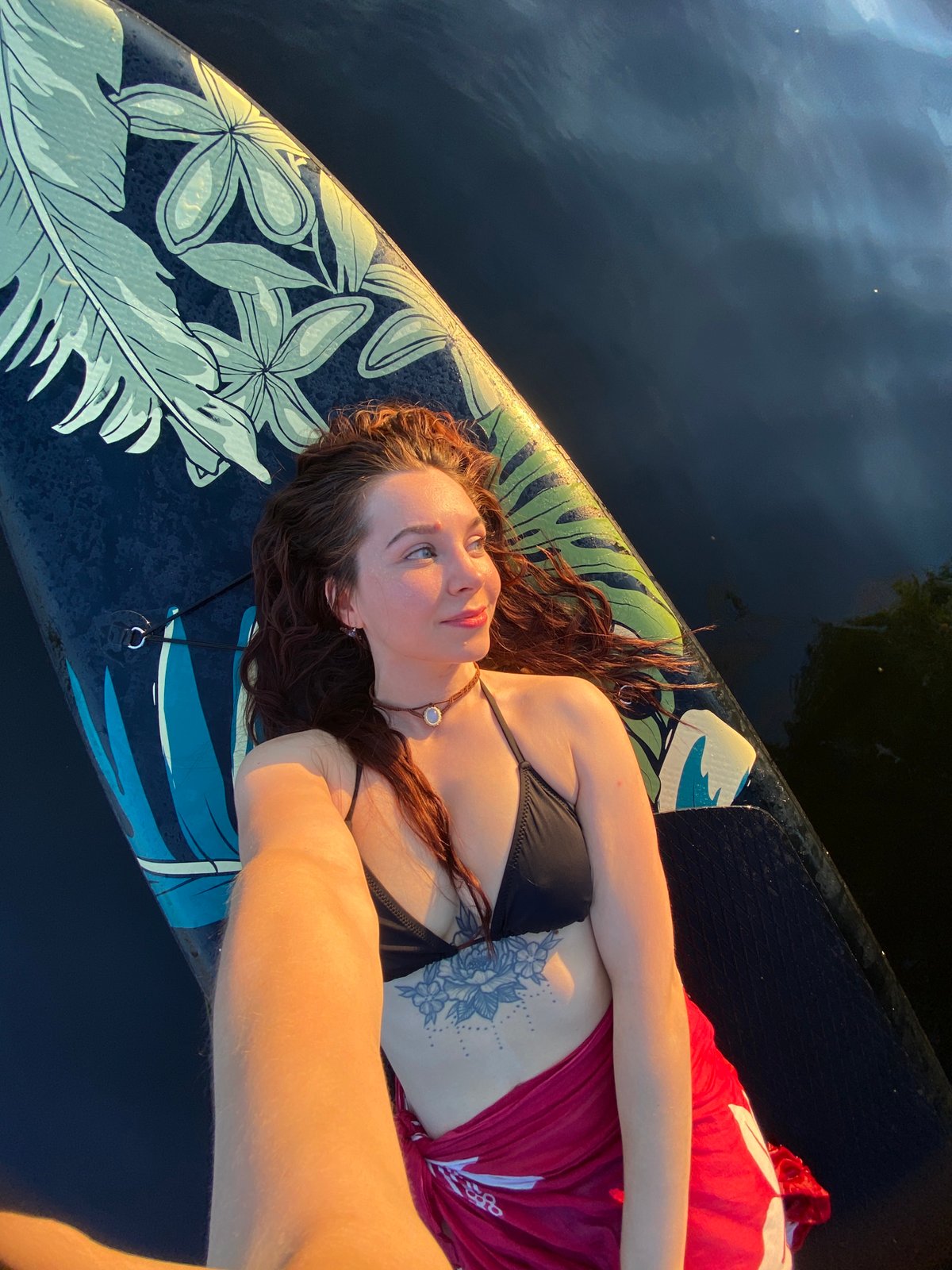 Summer evening on the Kama River, paddleboards and a jet ski