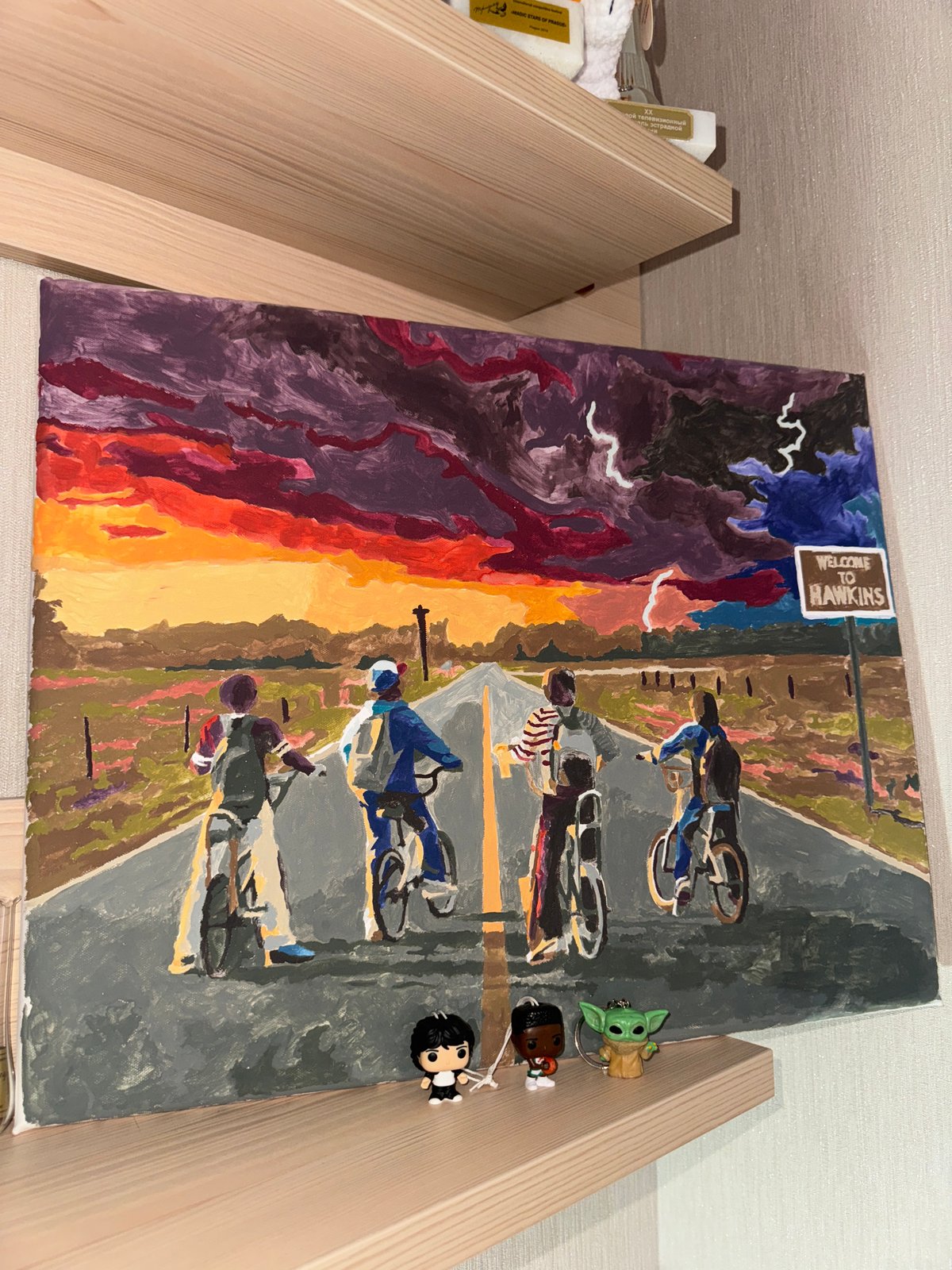 Krasnoyarsk resident documents home interior featuring art, awards, gray cat