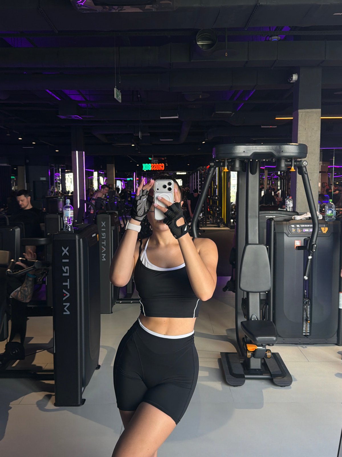 Woman documents workout session at Podolsk gym with selfies