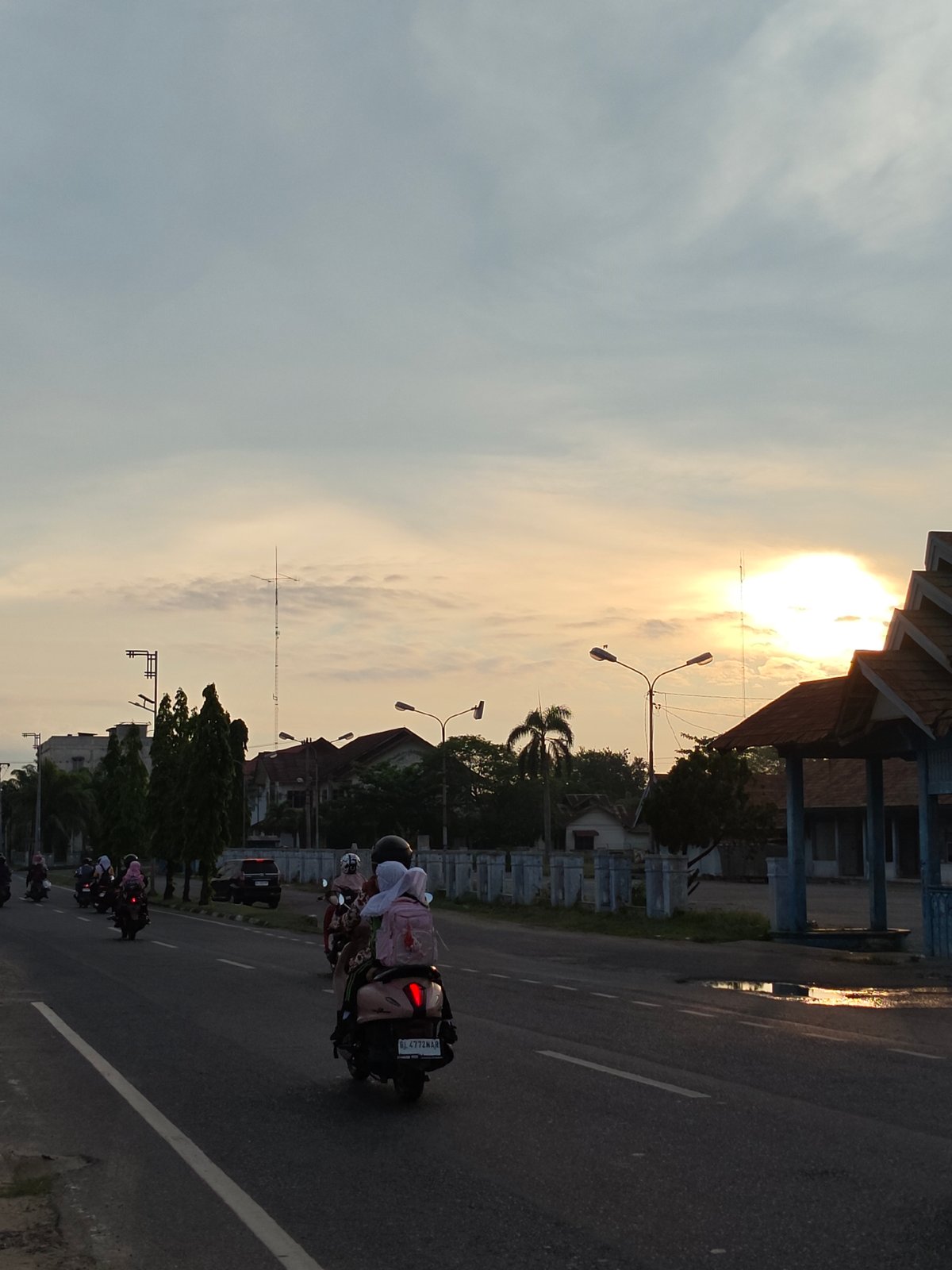 Evening traffic flows through Lhokseumawe streets