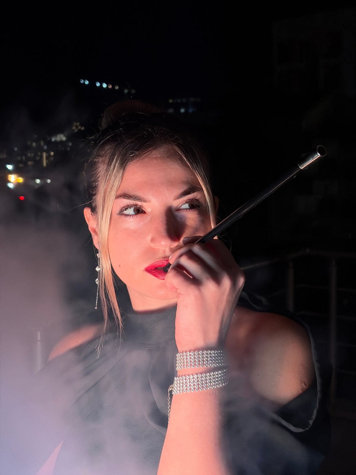 Balcony night in Budva: hookah, watermelon, and city lights