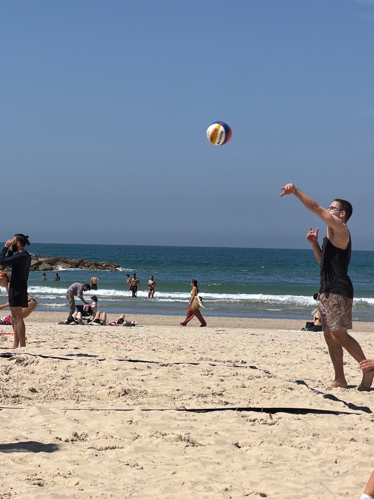 Tel Aviv beachgoers enjoy sunny morning recreational activities