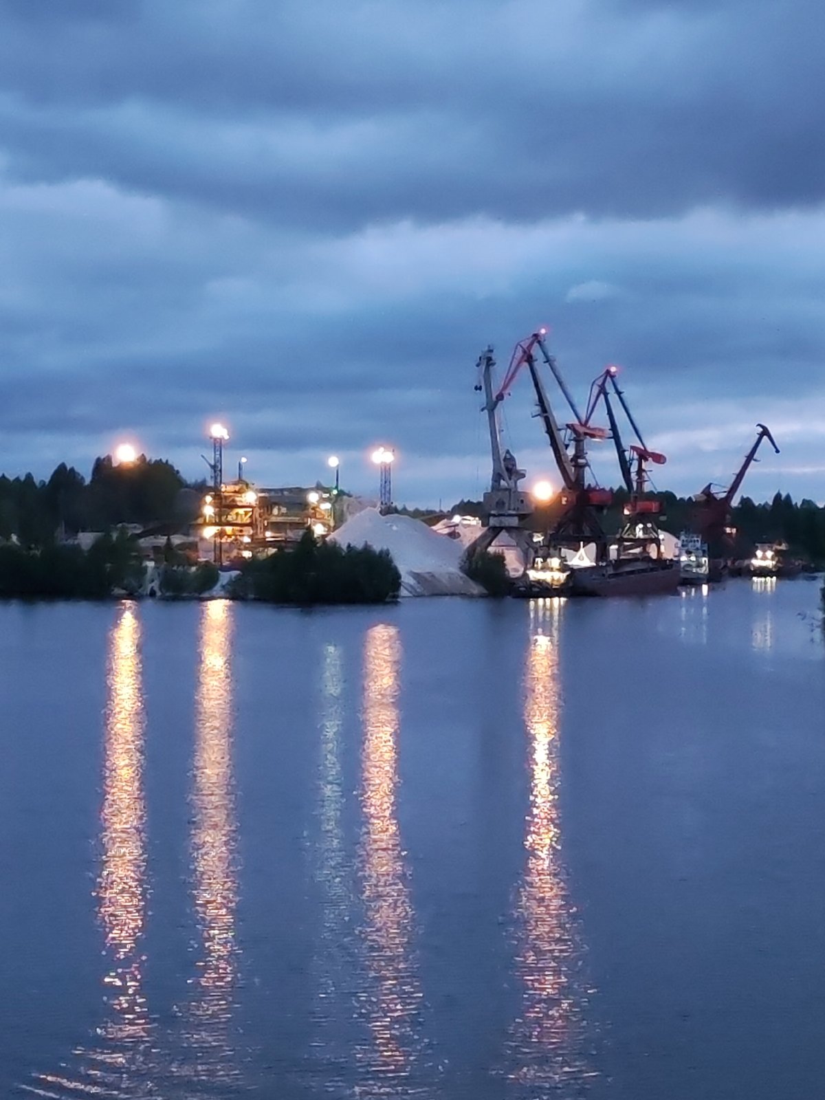 Russian industrial waterfronts observed at dusk with reflected lights