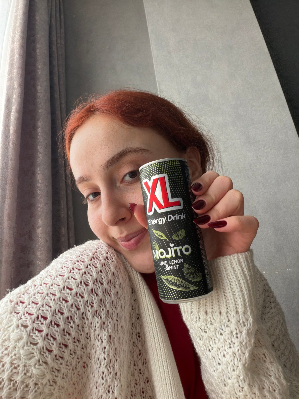 Woman photographed with energy drink in Tbilisi apartment