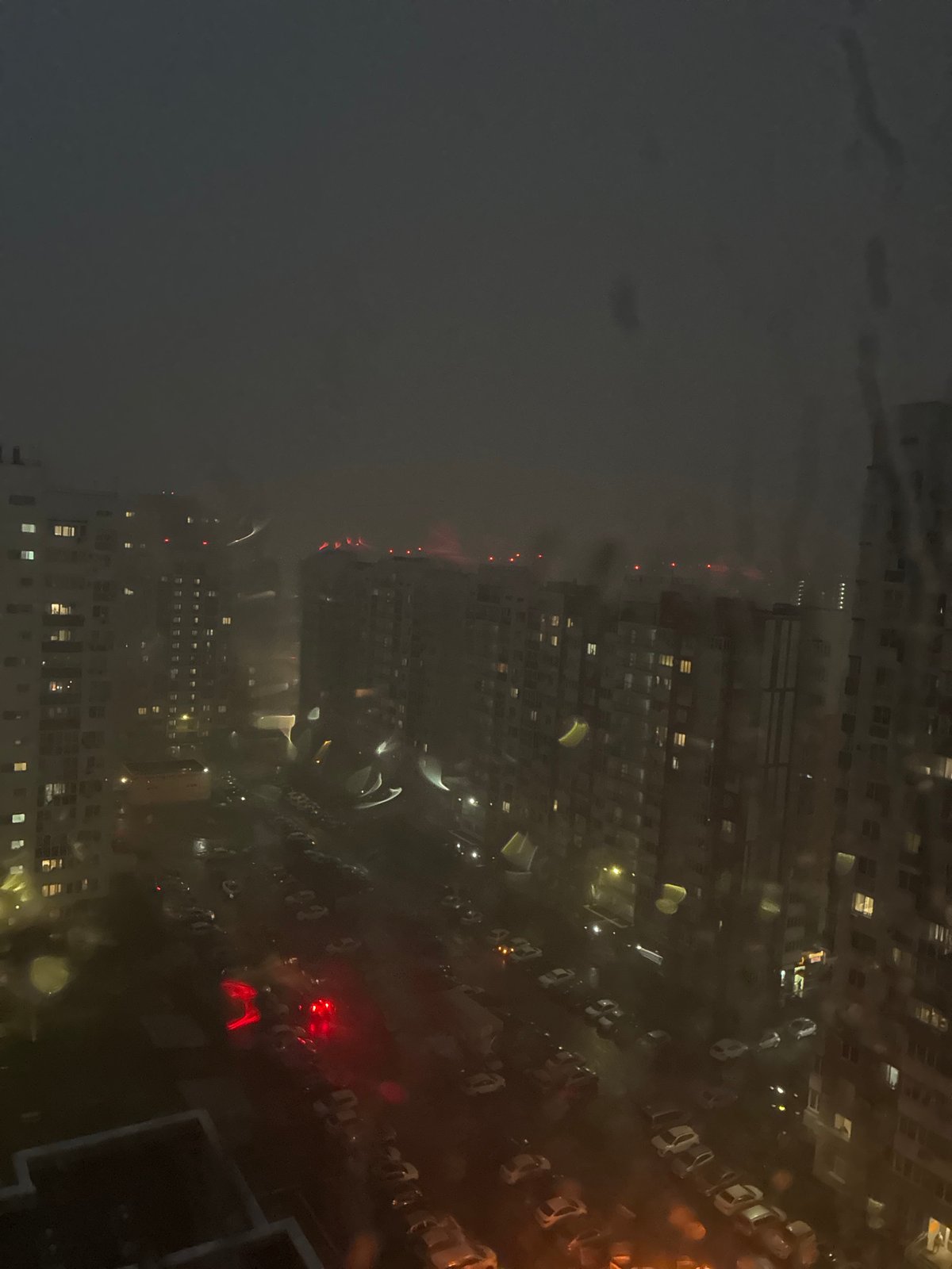 Rainy night view through a window in Orenburg