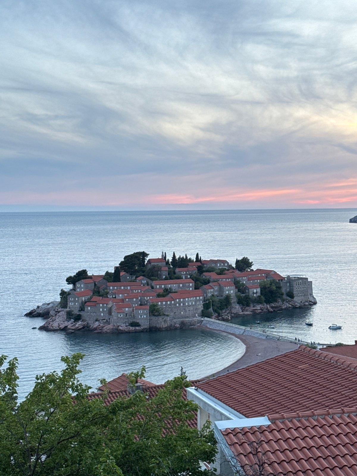 Tourist captures sunset moments at Montenegro's Sveti Stefan islet