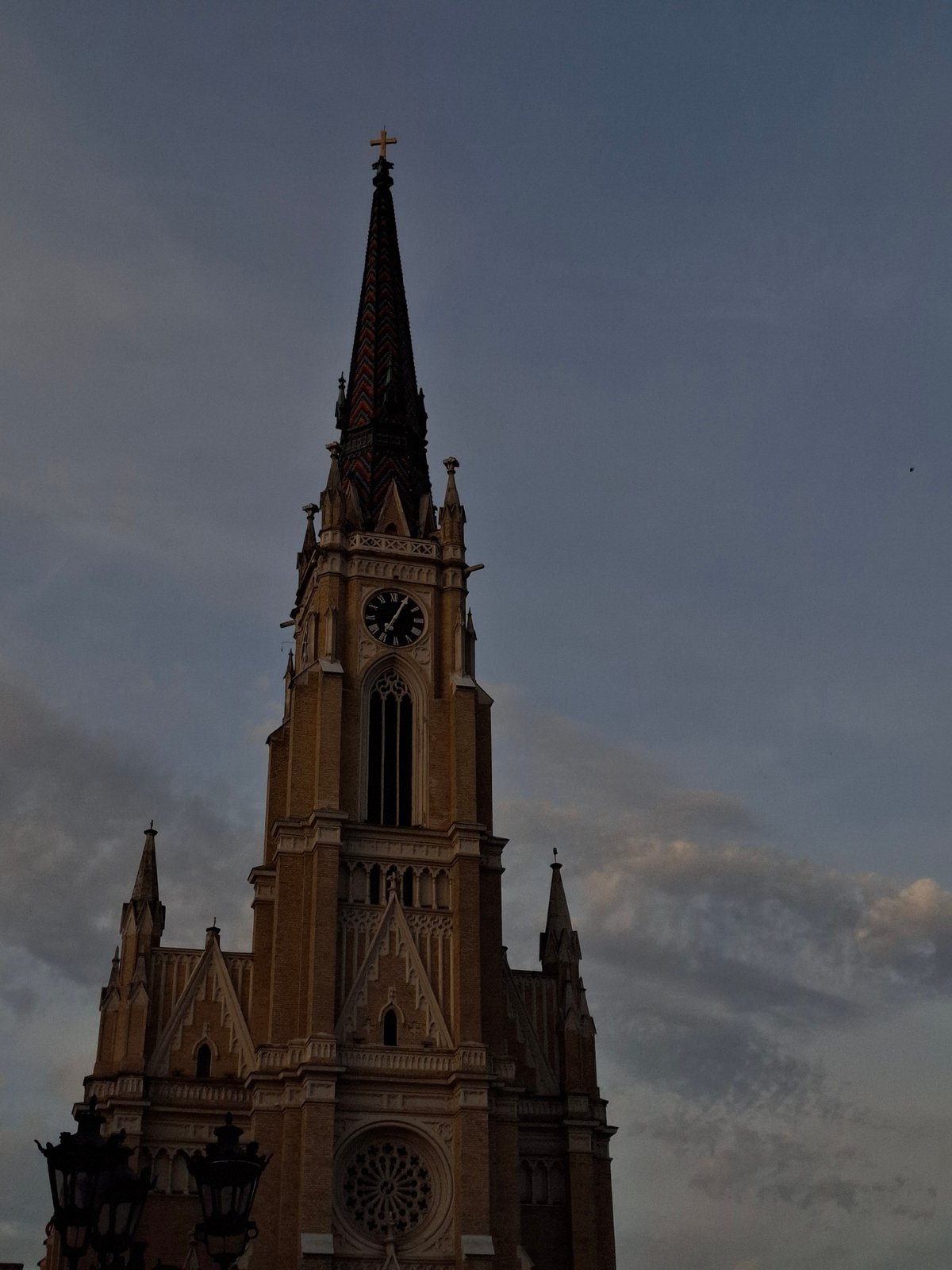 Street musician, cathedral views captured in Novi Sad square