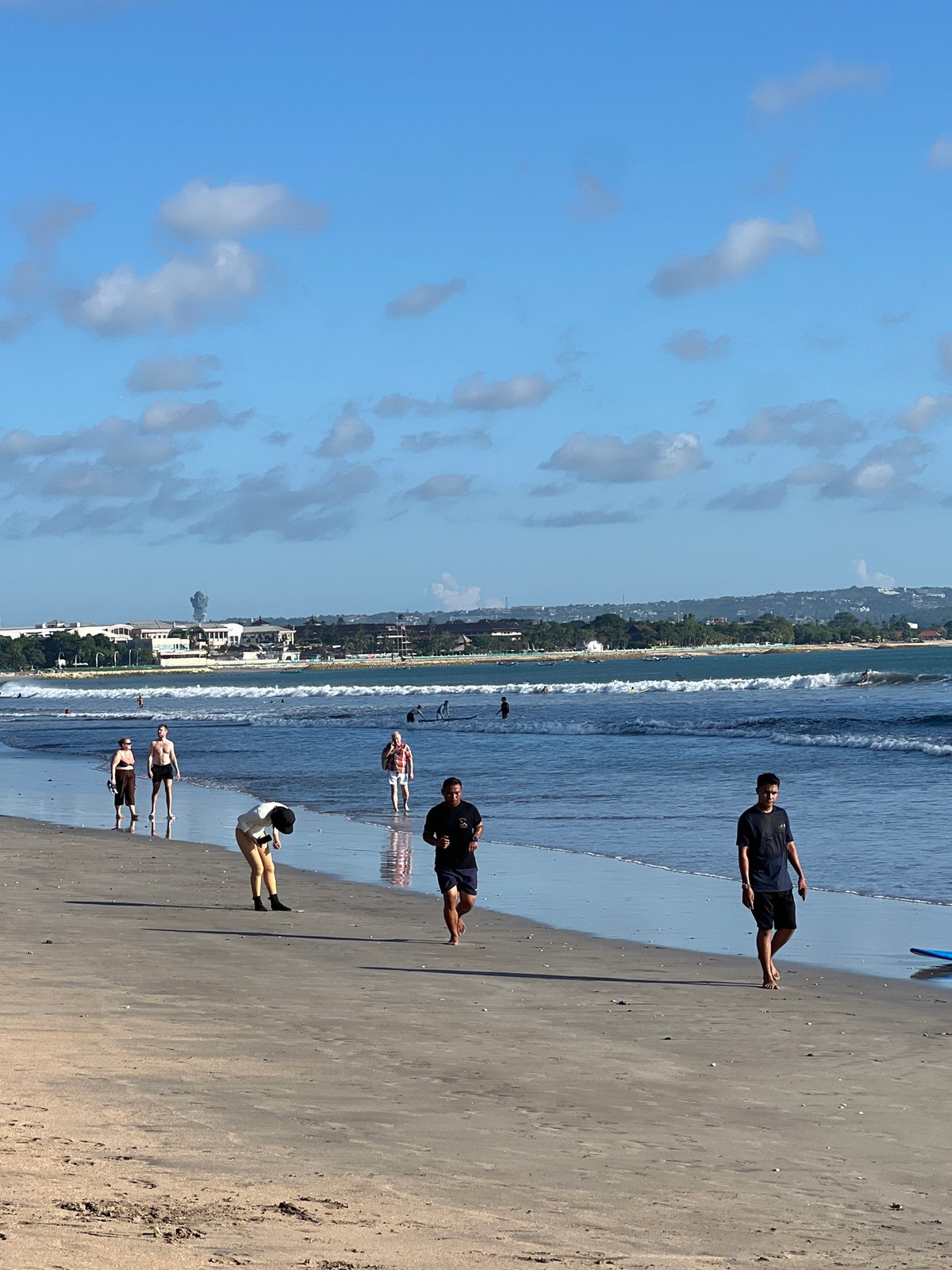 Typical sunny morning beach activities observed at Kuta, Indonesia