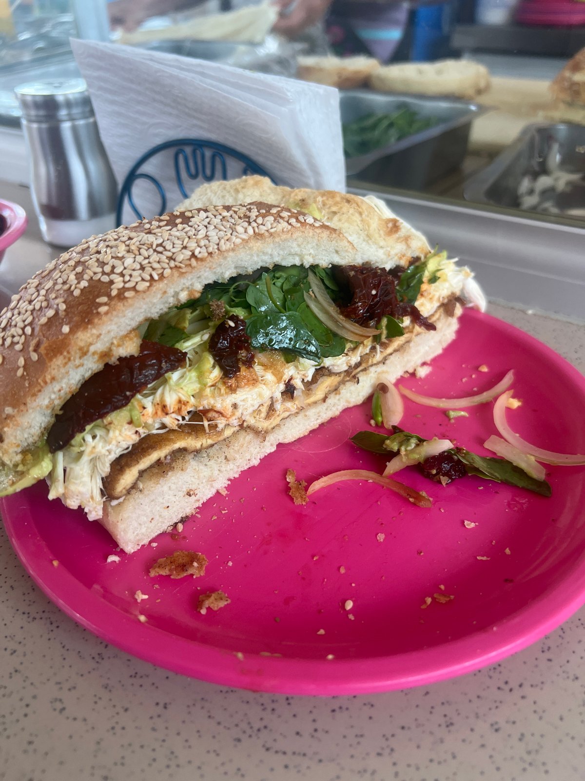 Partially eaten vegetable sandwich documented in Puebla, Mexico