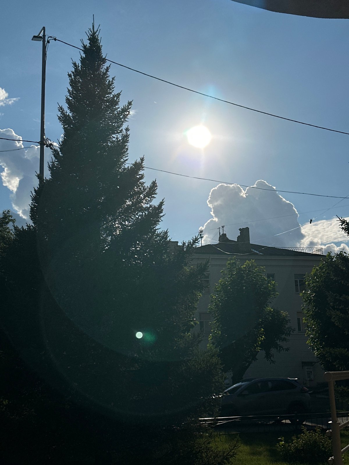 Sunny afternoon in Kokshetau, clouds building over the city