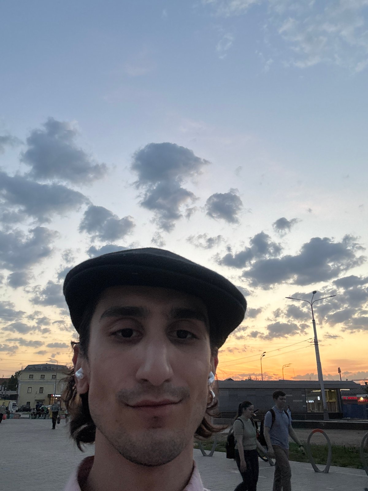 Moscow resident documents cloudy sunset with crescent moon visible