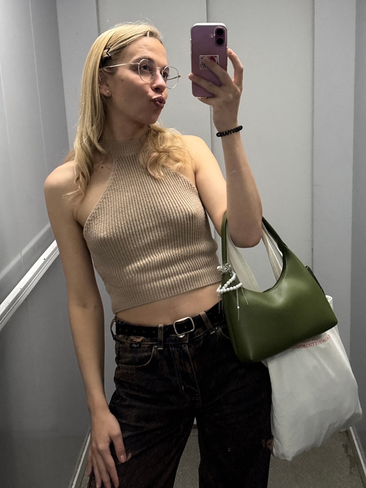 Woman takes selfie with purple phone in Krasnoyarsk