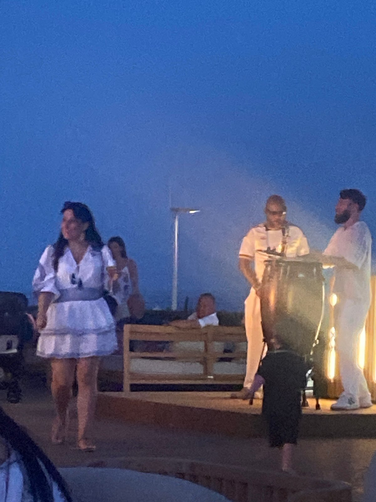 Estepona resort at dusk: coastal paths, live drums, evening crowd