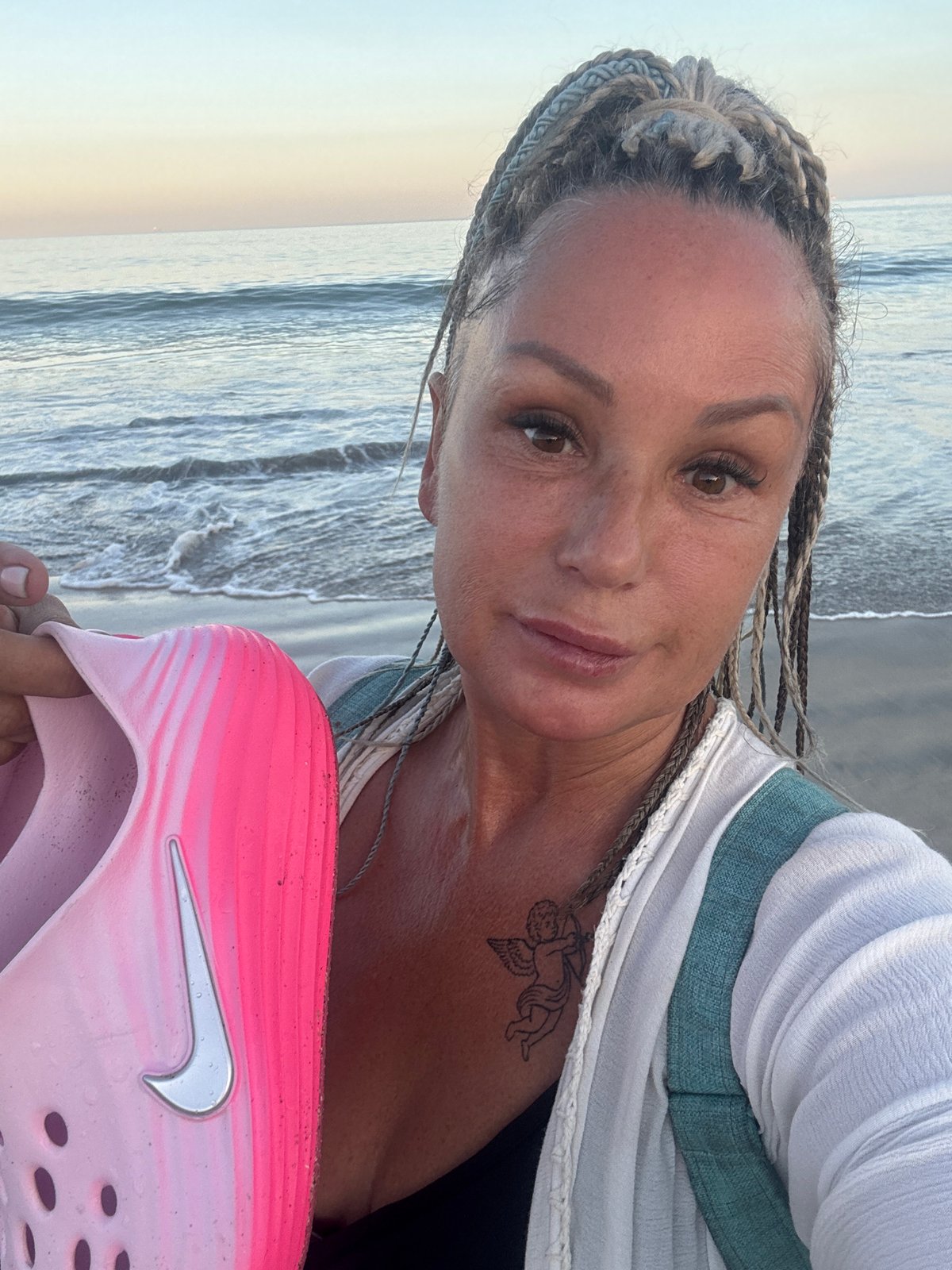 Woman takes selfie on Kuta Selatan beach