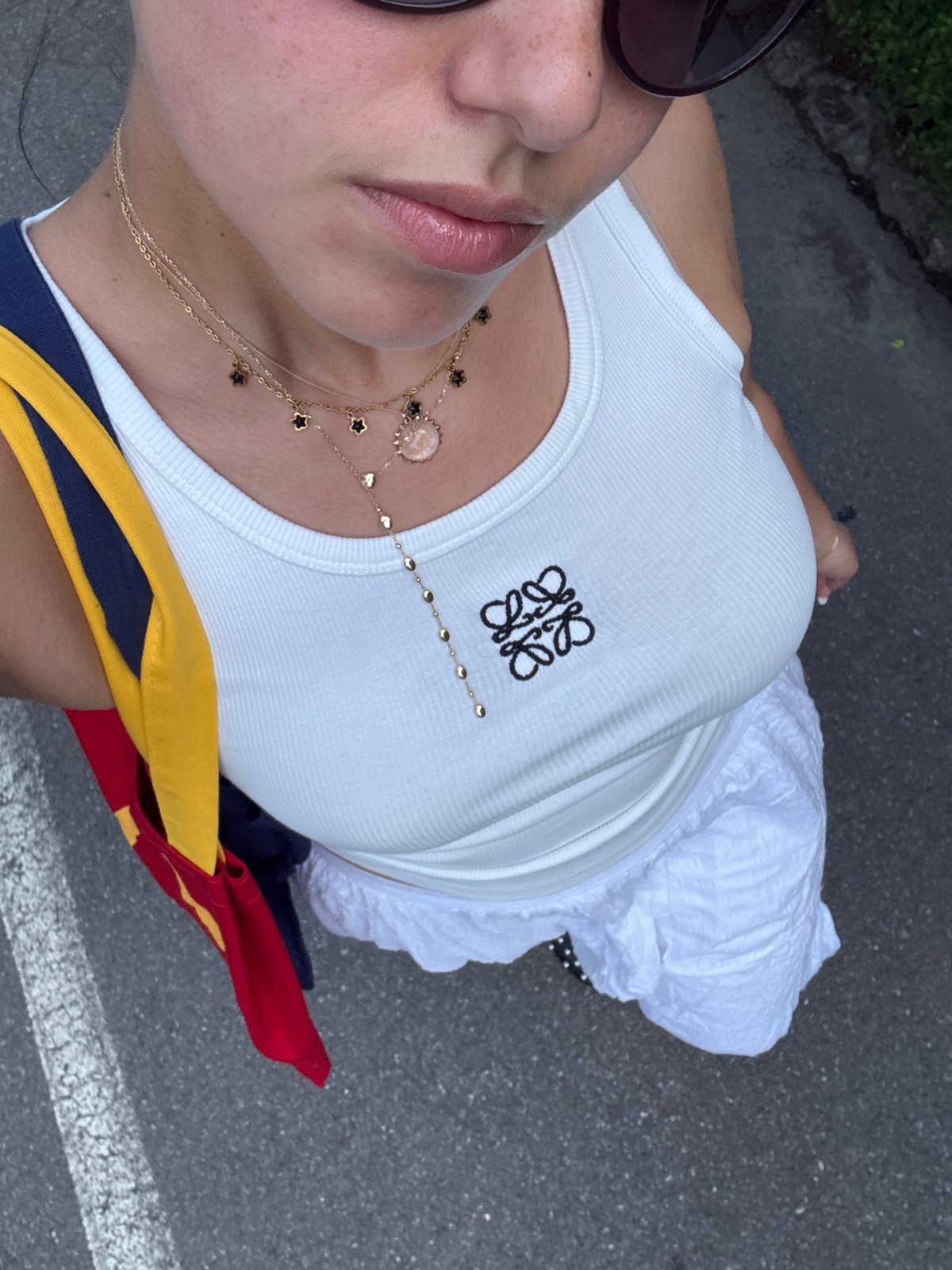 Woman in designer tank top photographed in Milan