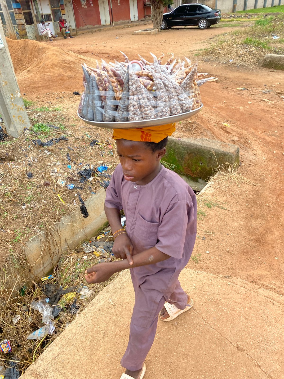 Everyday trade and foot traffic on the streets of Bukuru, Nigeria
