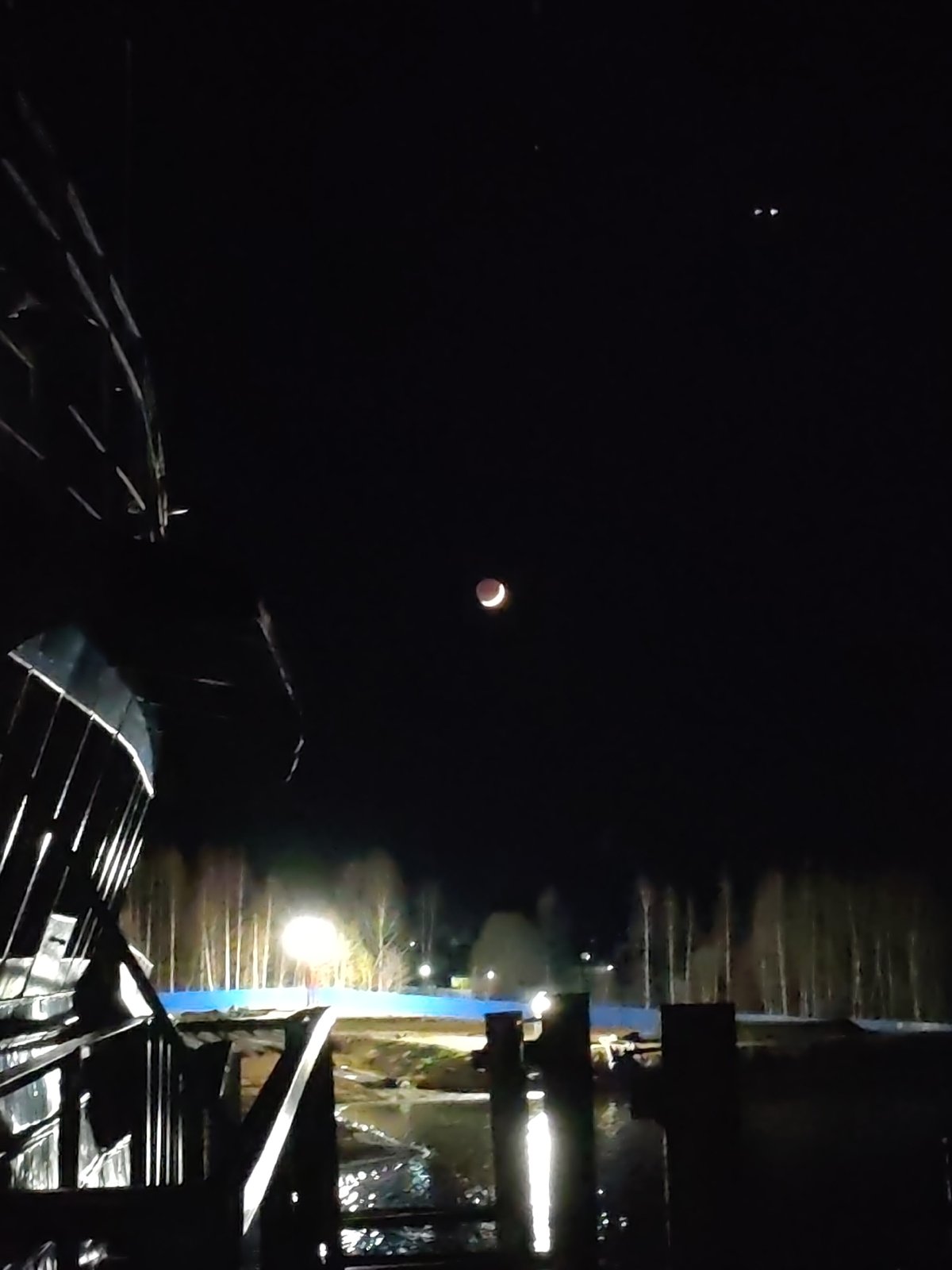 Partial lunar eclipse observed over Bol'shie Mkhi, Russia