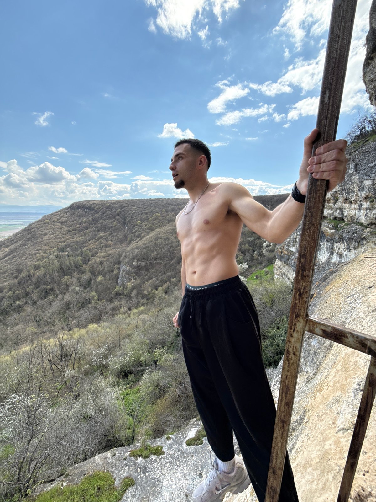 Man performs calisthenics exercise at high altitude in Shumen
