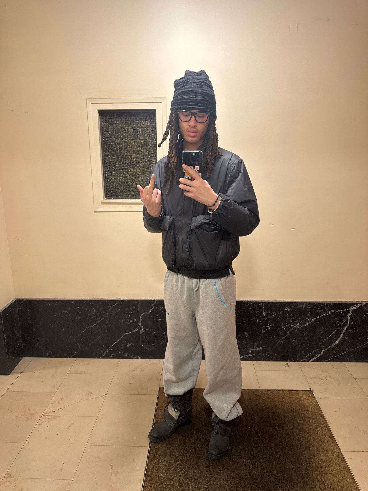 Person takes indoor selfie in Paris building