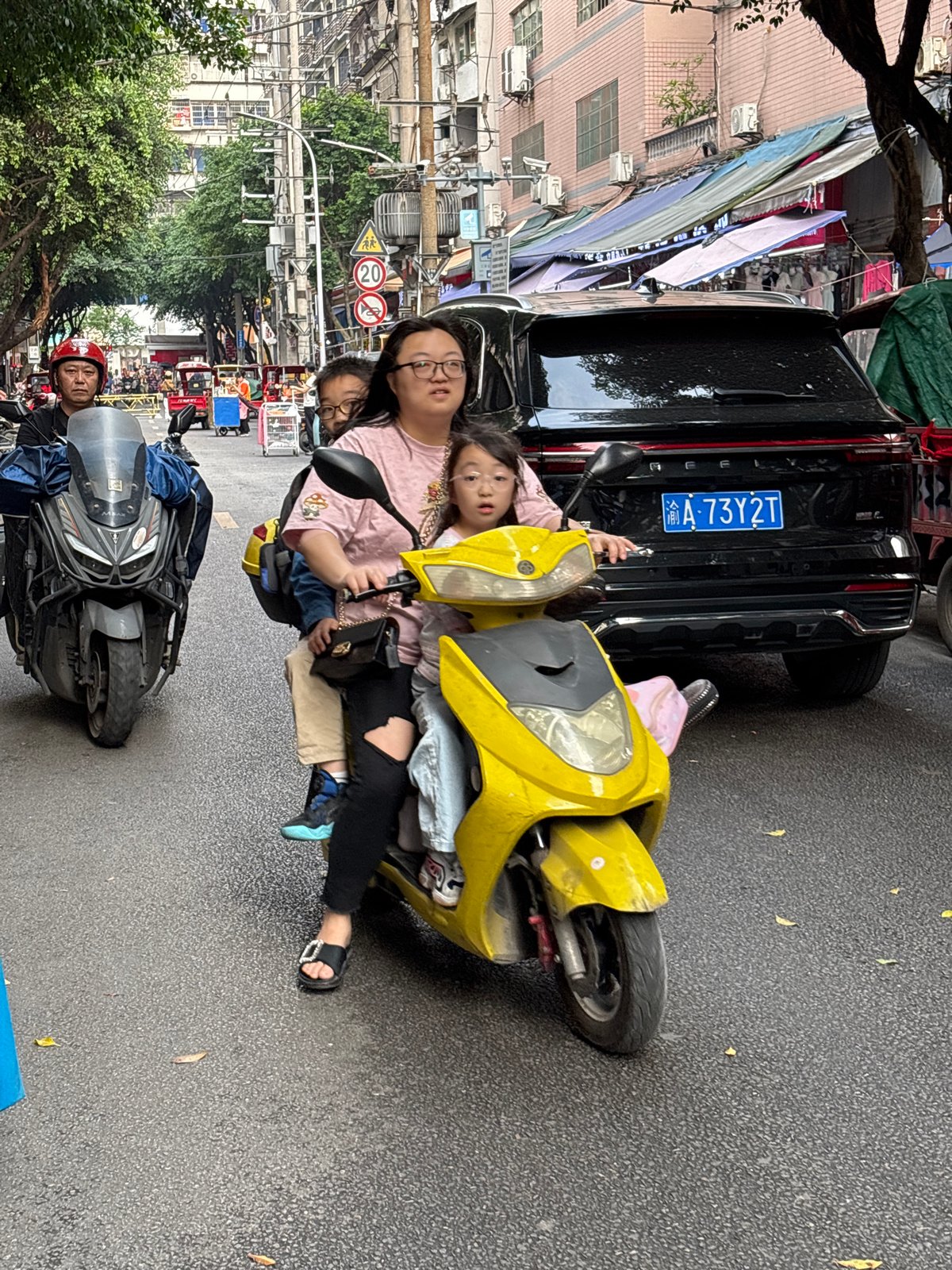Morning street scene with scooters in Jiangjin, China