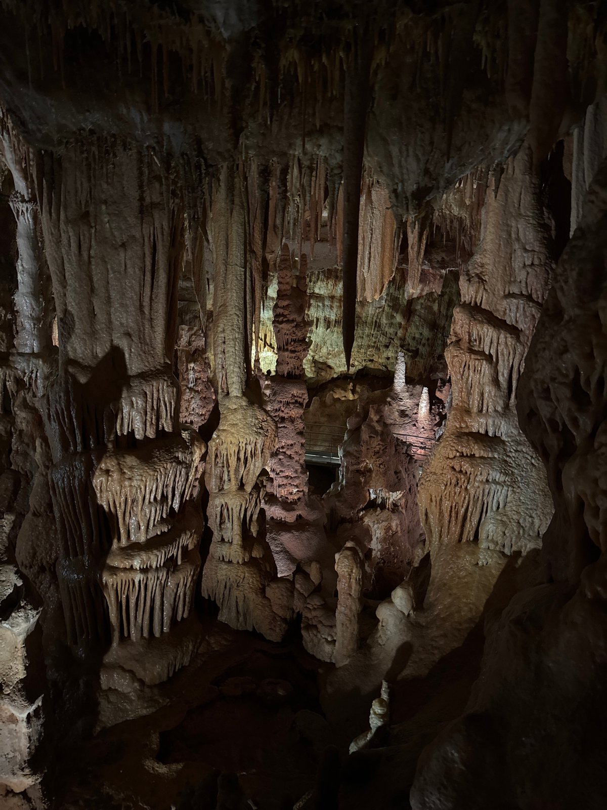 Visitors document limestone formations inside Petralona Cave, Greece