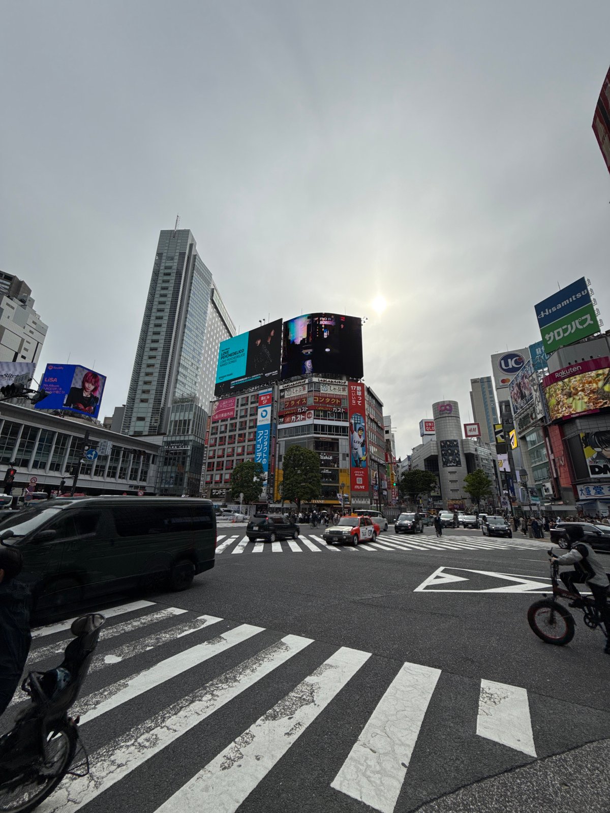 Morning crowds gather at sunny Shibuya Crossing, Tokyo
