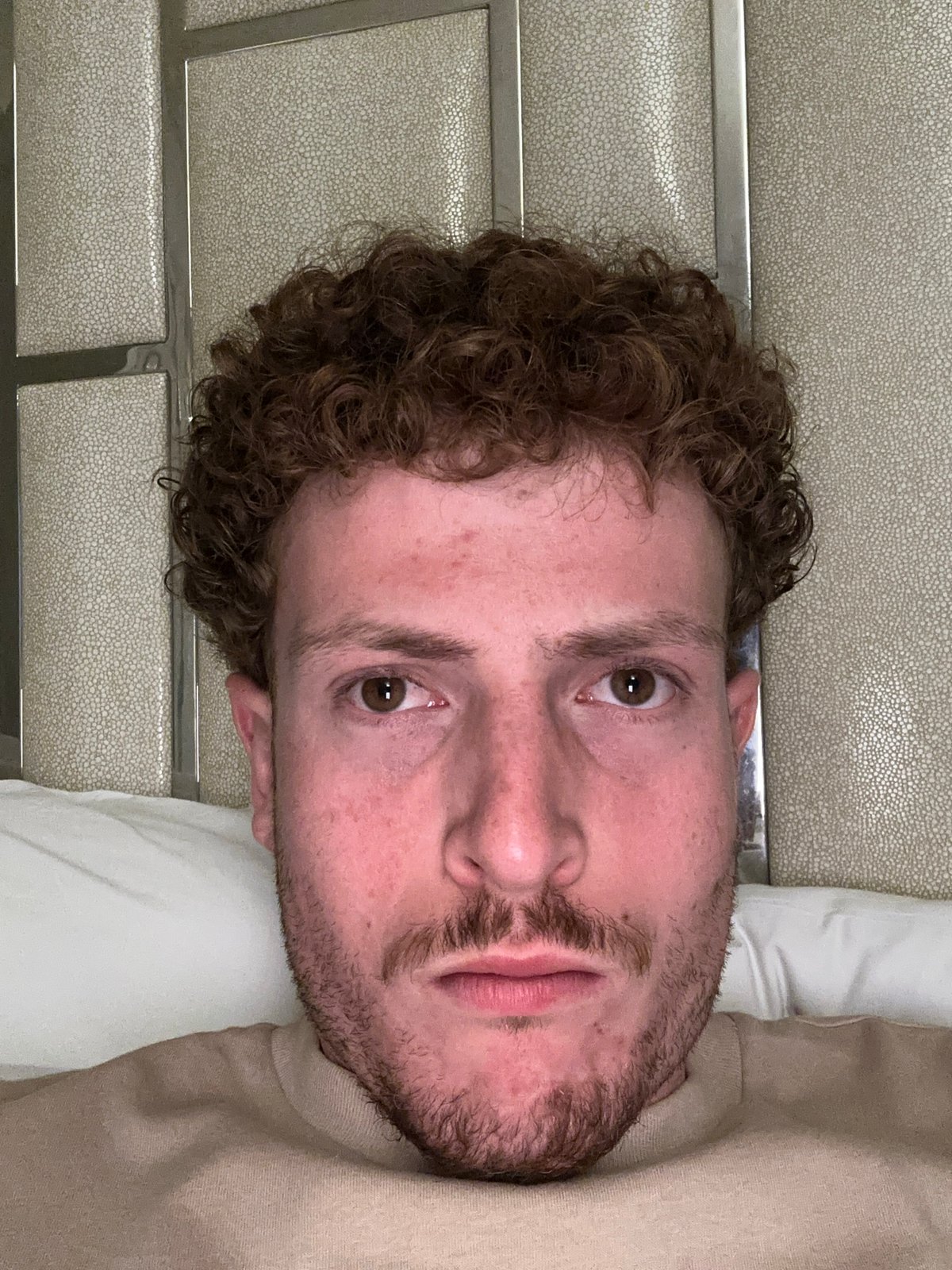 Person documented in bedroom setting in Aventura, Florida