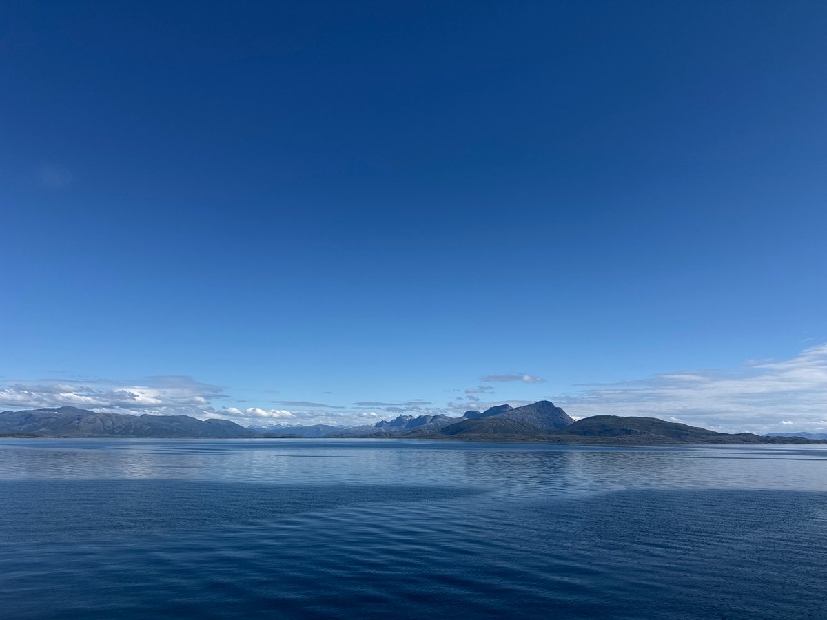 Clear skies over calm Arctic waters off Lødingen, Norway