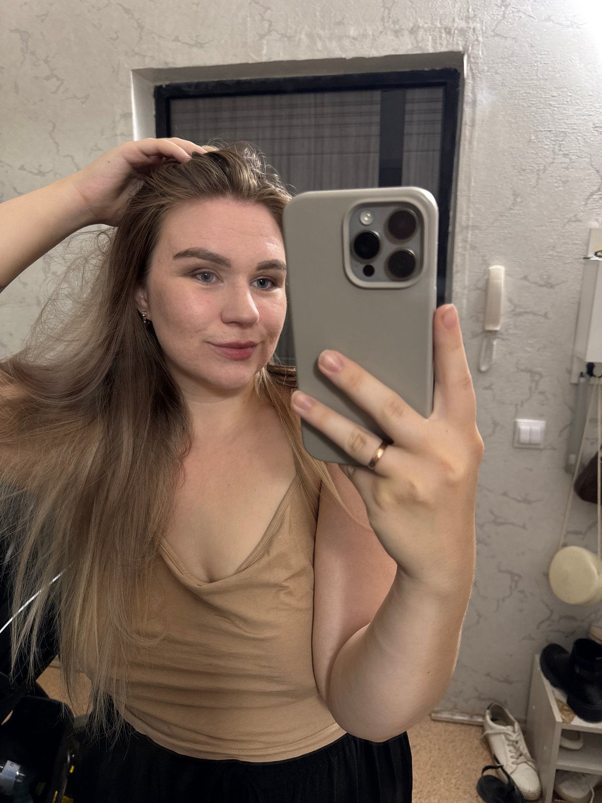 Woman captures selfies, roses during afternoon in Chaikovsky, Russia