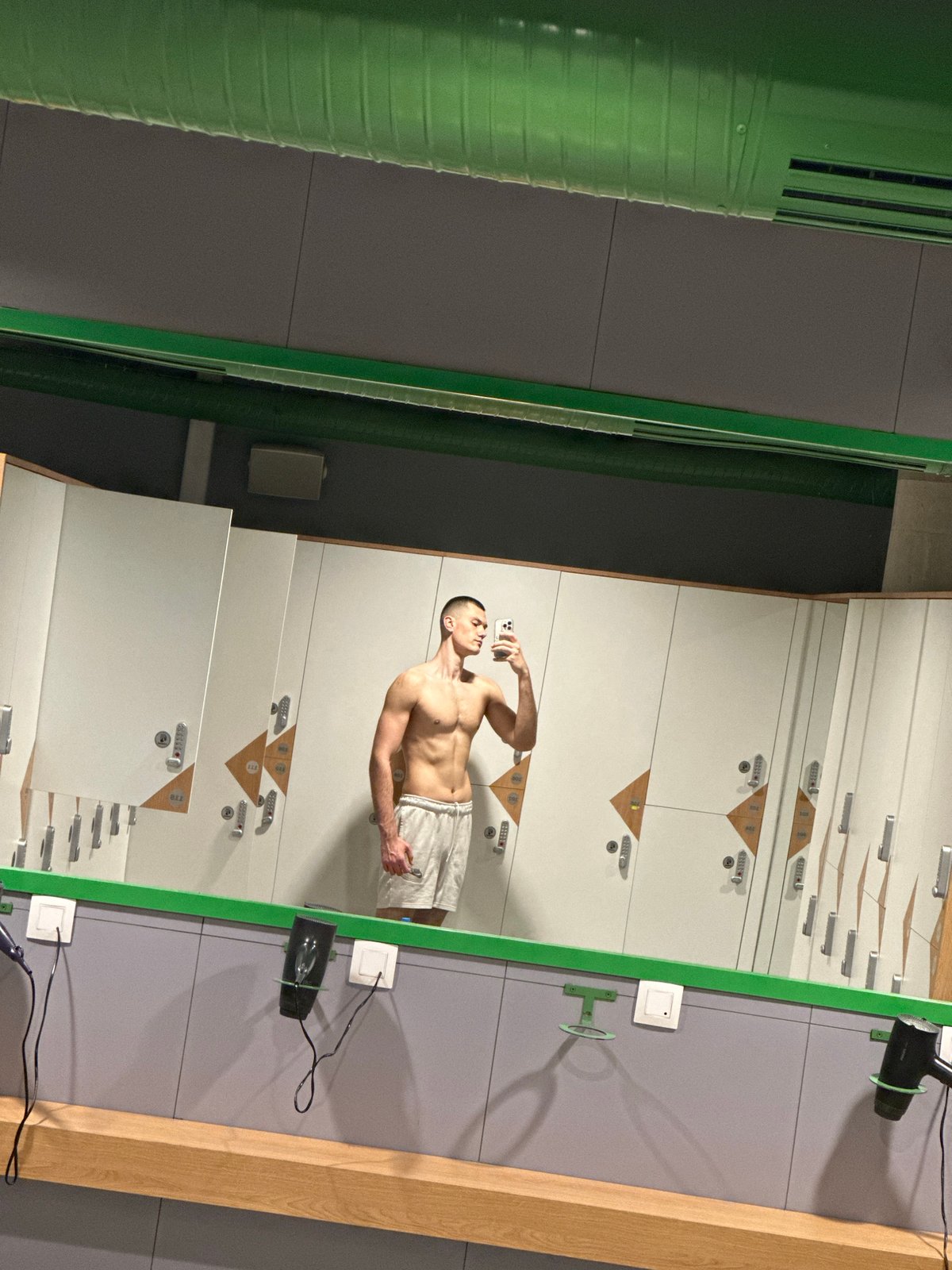 Person takes selfies in Sofia locker room facility