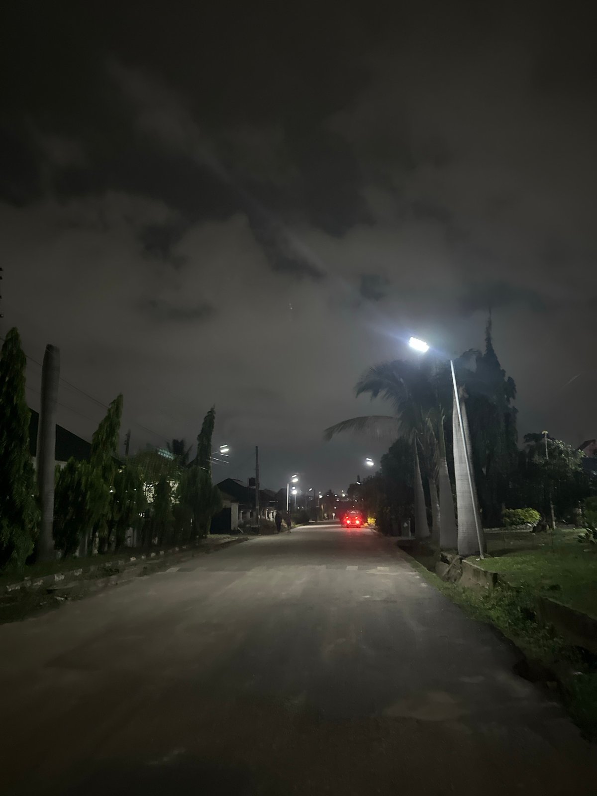 Nighttime residential streets in Abuja, quiet and overcast