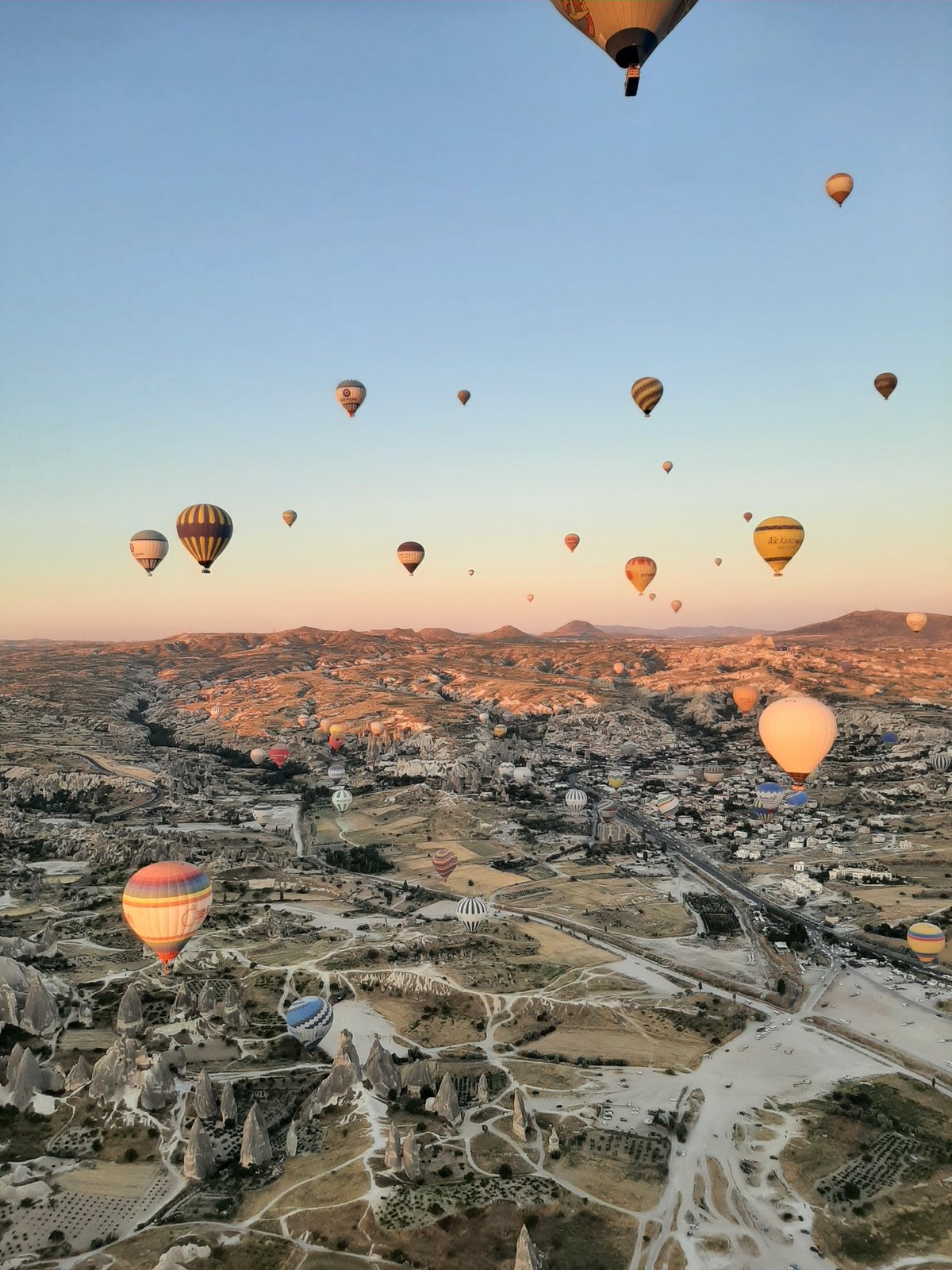 Hot air balloons drift over Göreme's iconic Cappadocia landscape