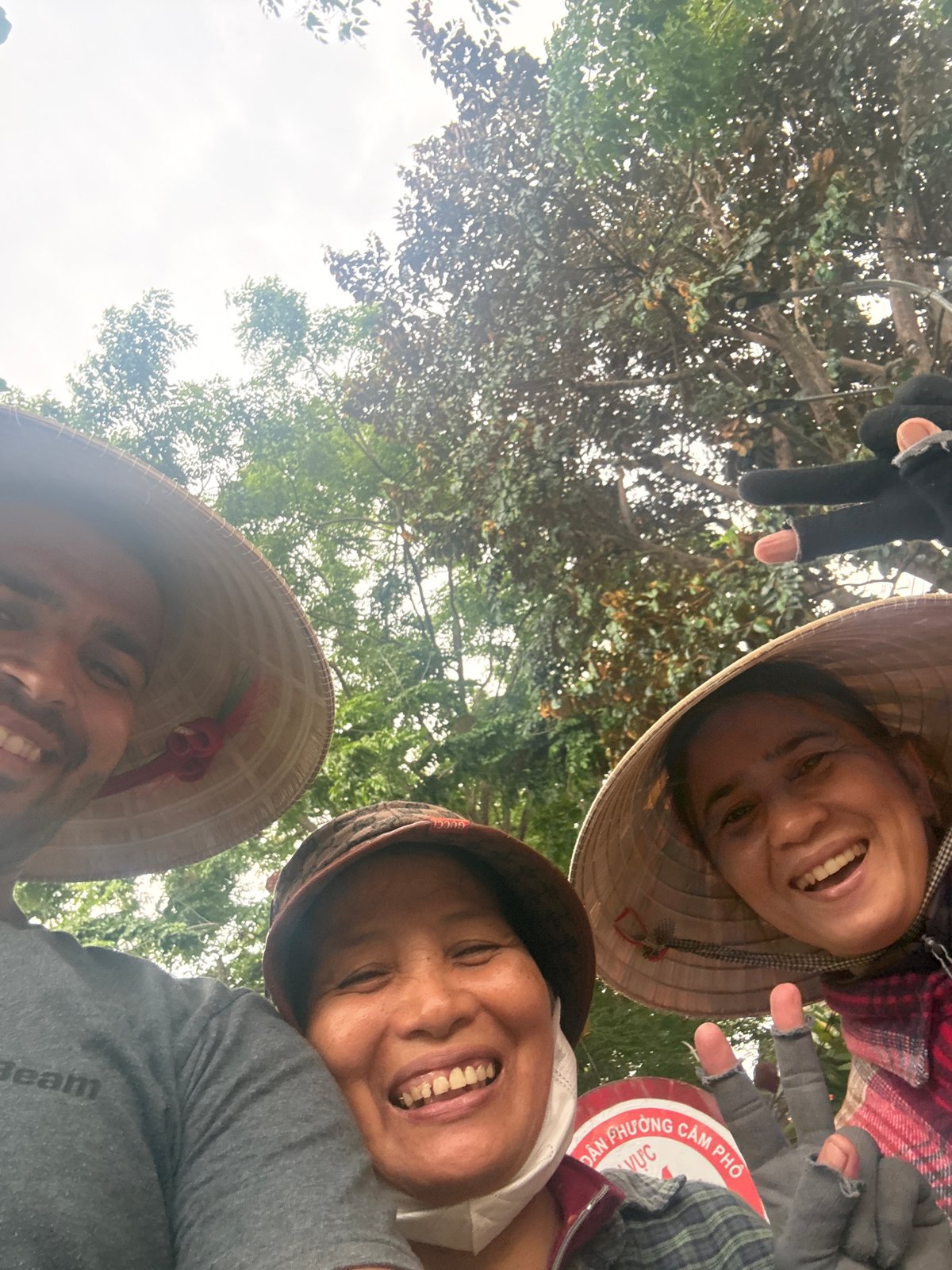 Tourists pose with traditional Vietnamese items in Hội An