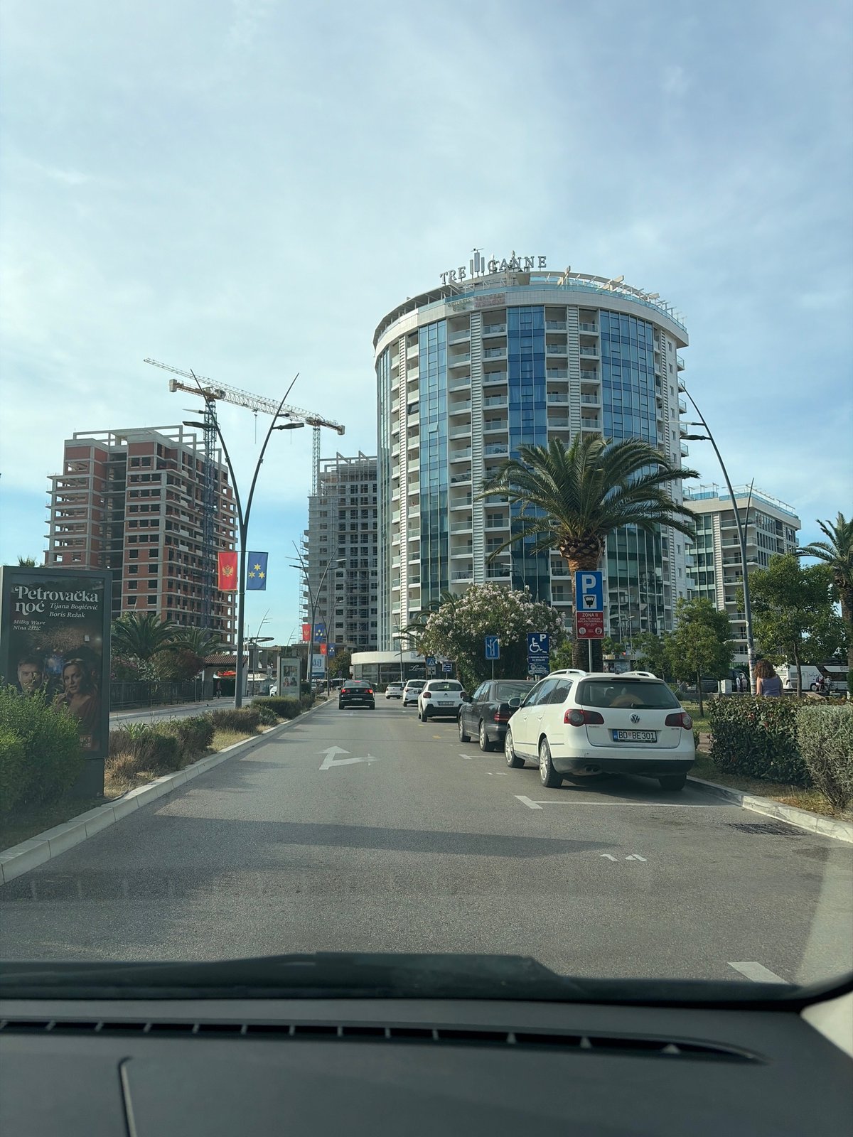 Morning observations capture Budva architecture and resident in car