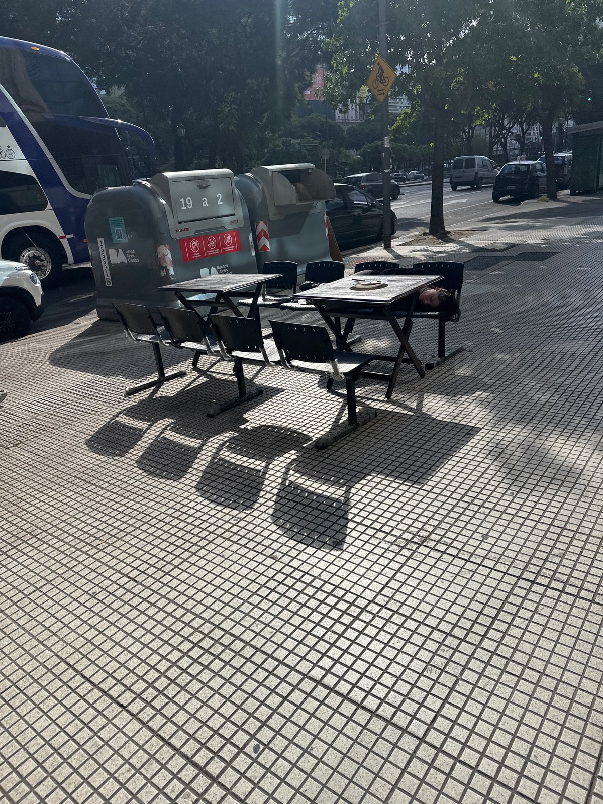 Outdoor cafe scene observed on Buenos Aires sidewalk