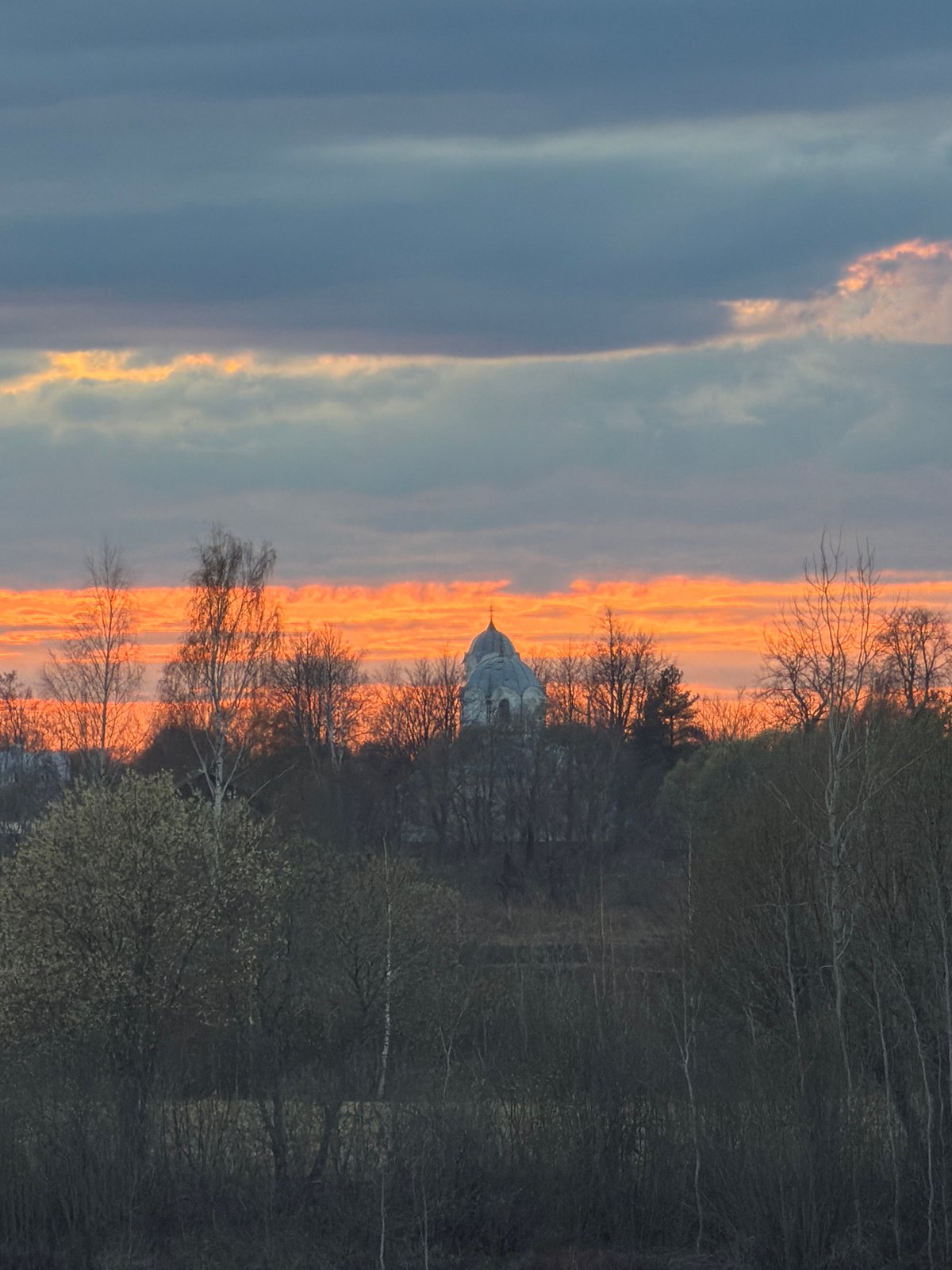 Sunset observed over classical building and water at remote location