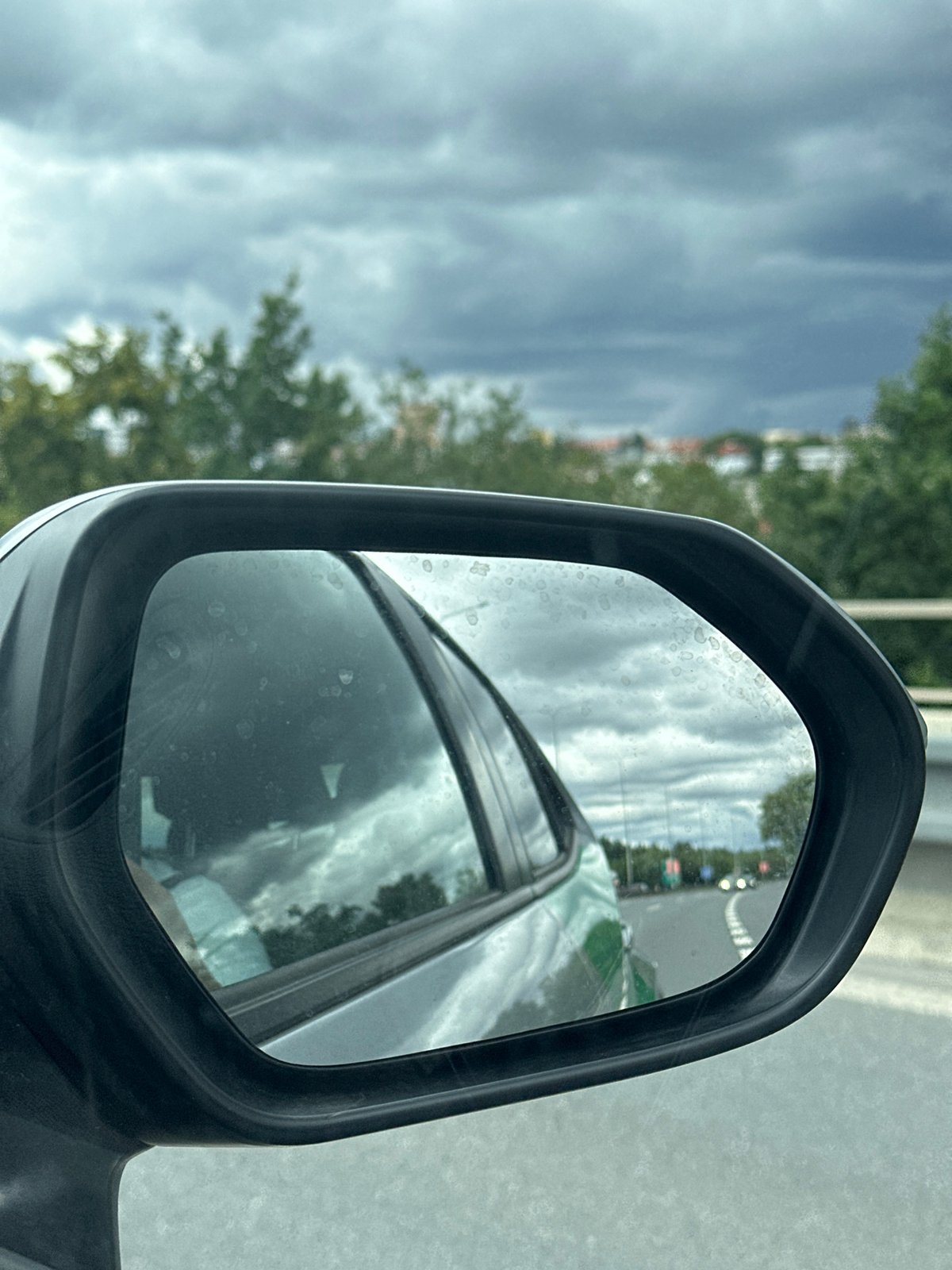Silver Bolt Drive hybrid out on wet urban roads