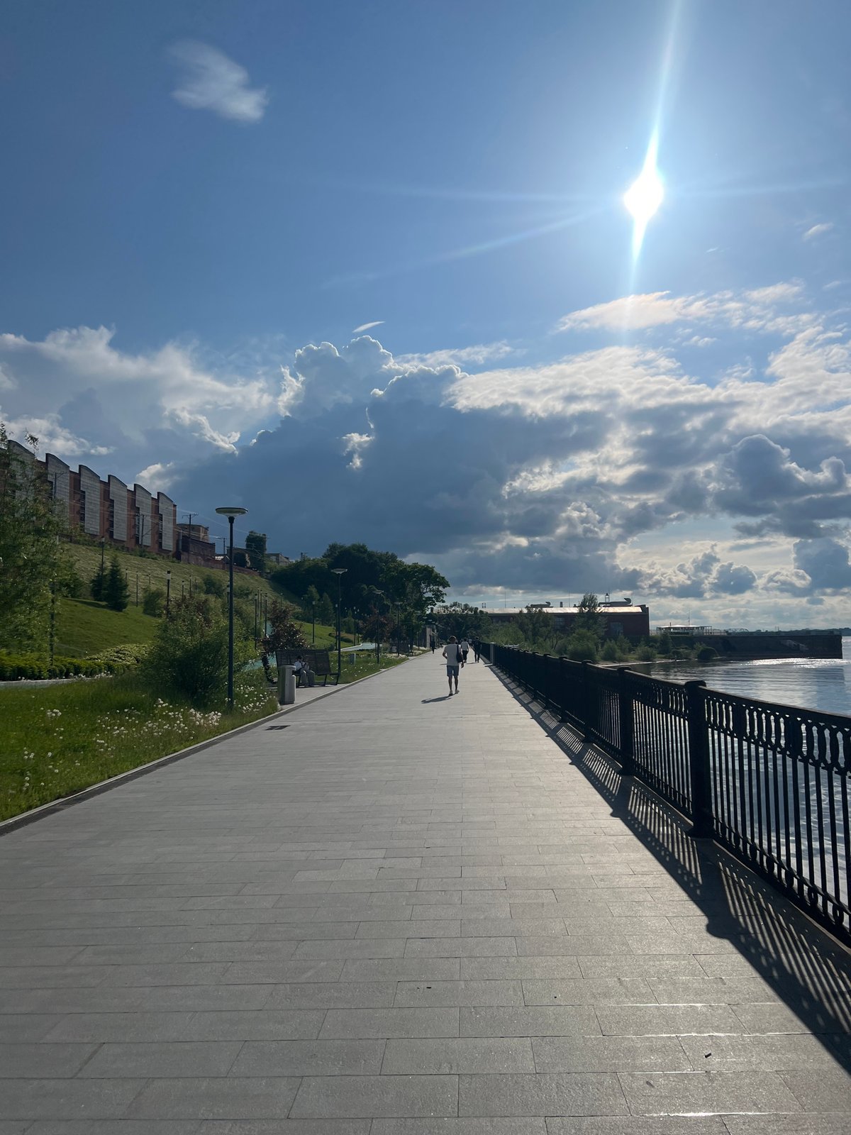Witness documents Perm Embankment along Kama River under cloudy skies