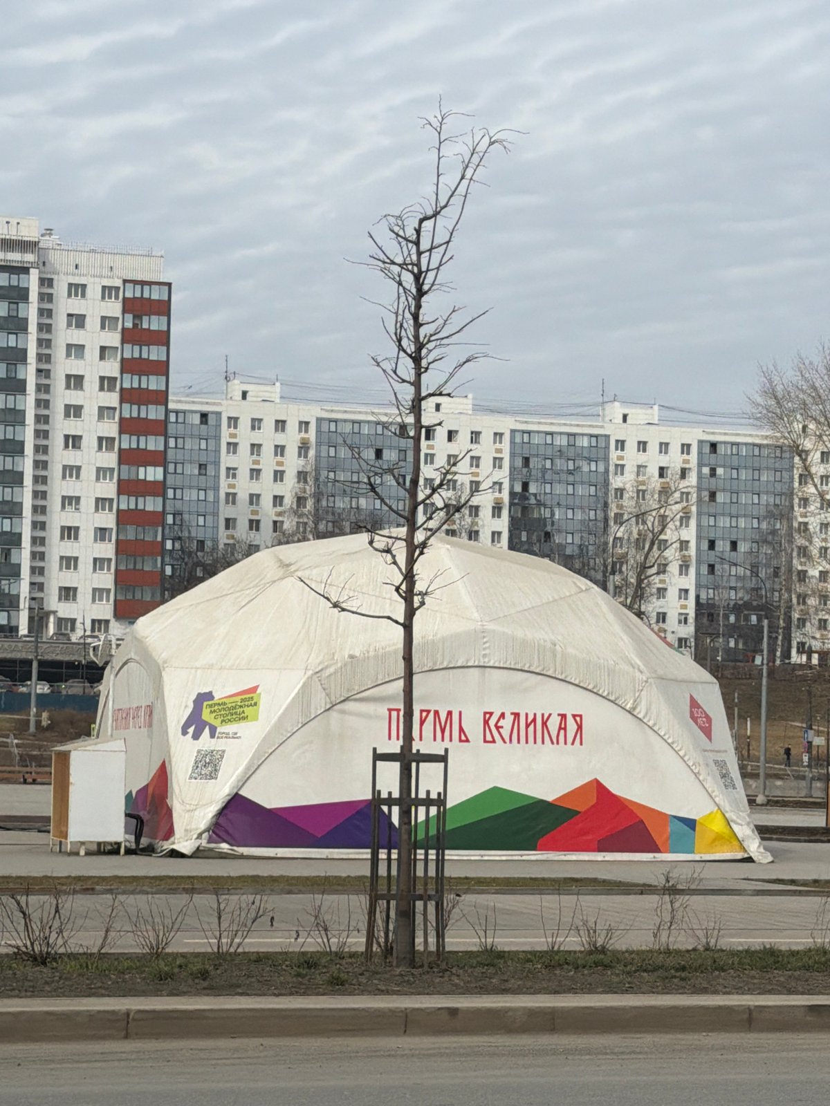 Morning street life documented around Tatishchev statue in Perm
