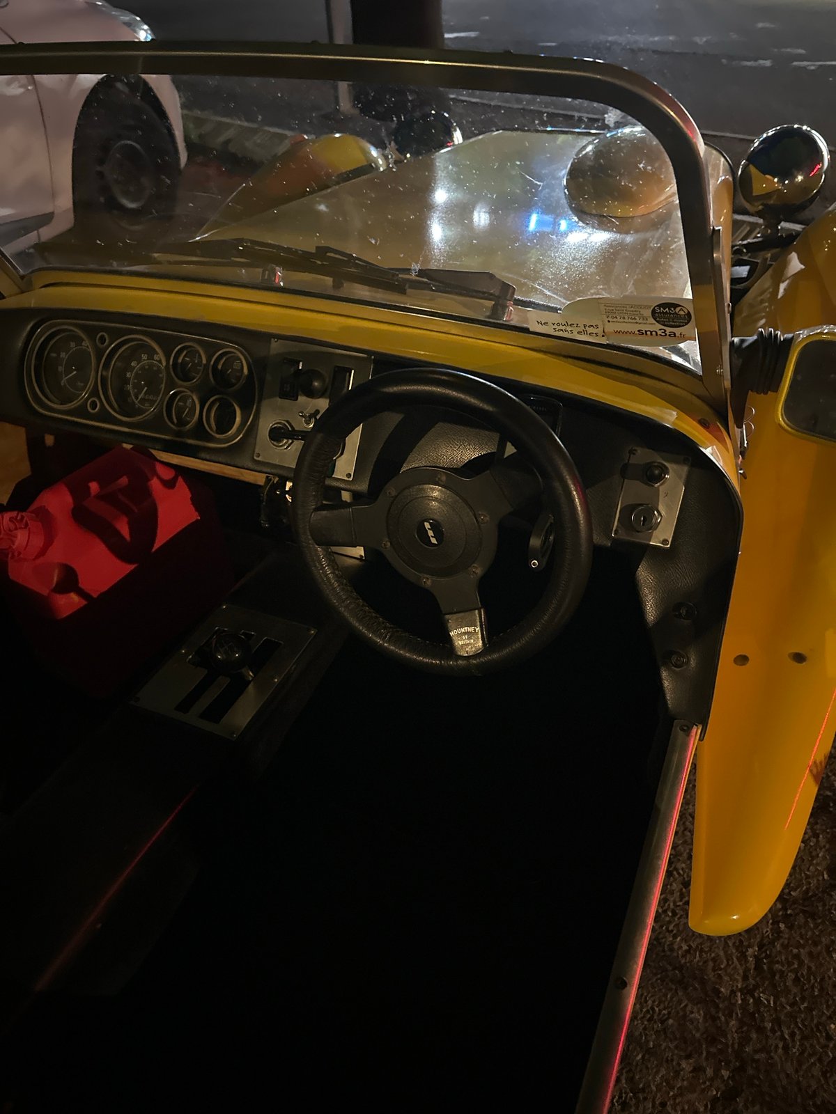 Yellow sports car and late-night streets in Anduze